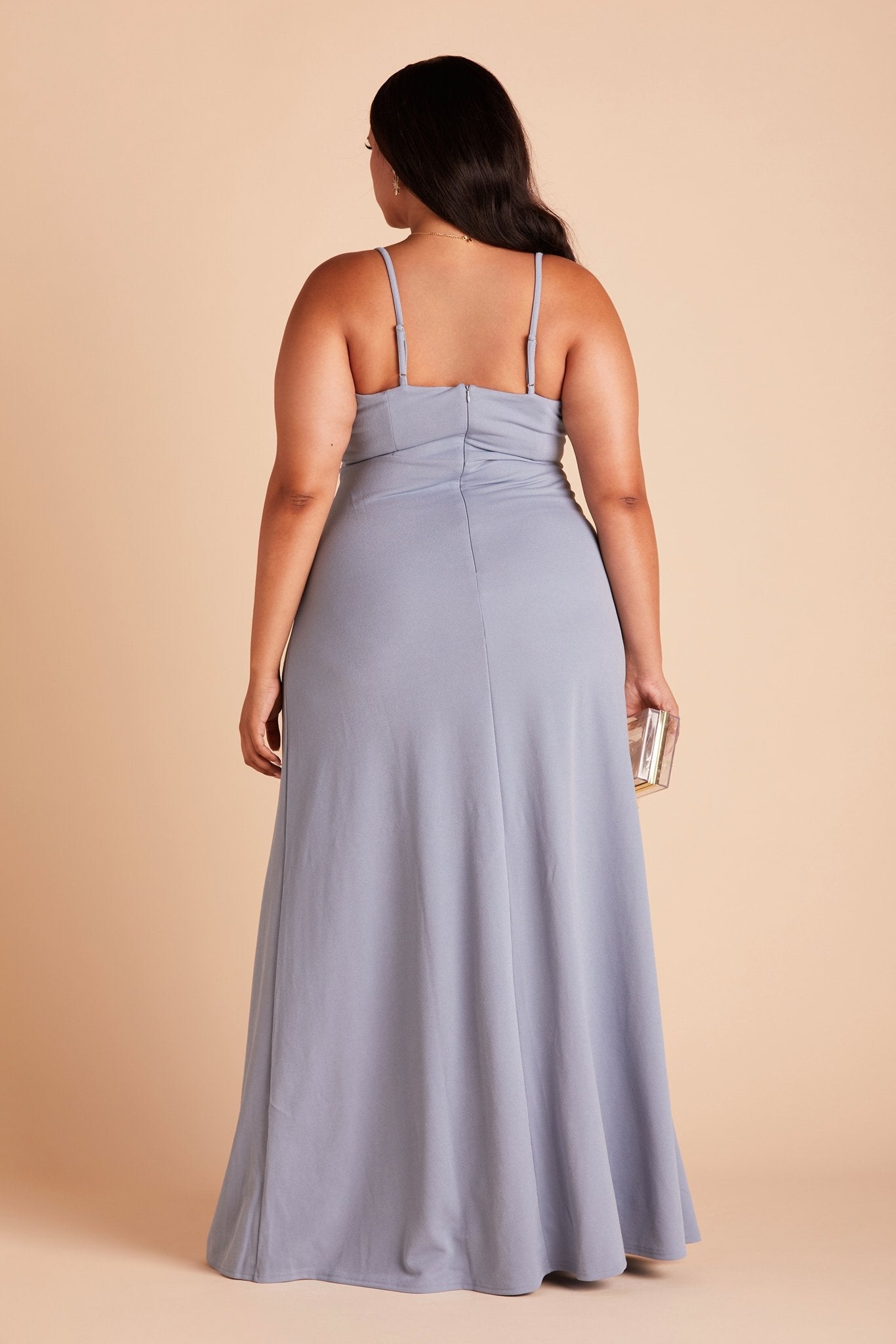 Back view of the Ash Plus Size Bridesmaid Dress  in dusty blue crepe shows skinny adjustable straps as well as an open back just below shoulder blades.