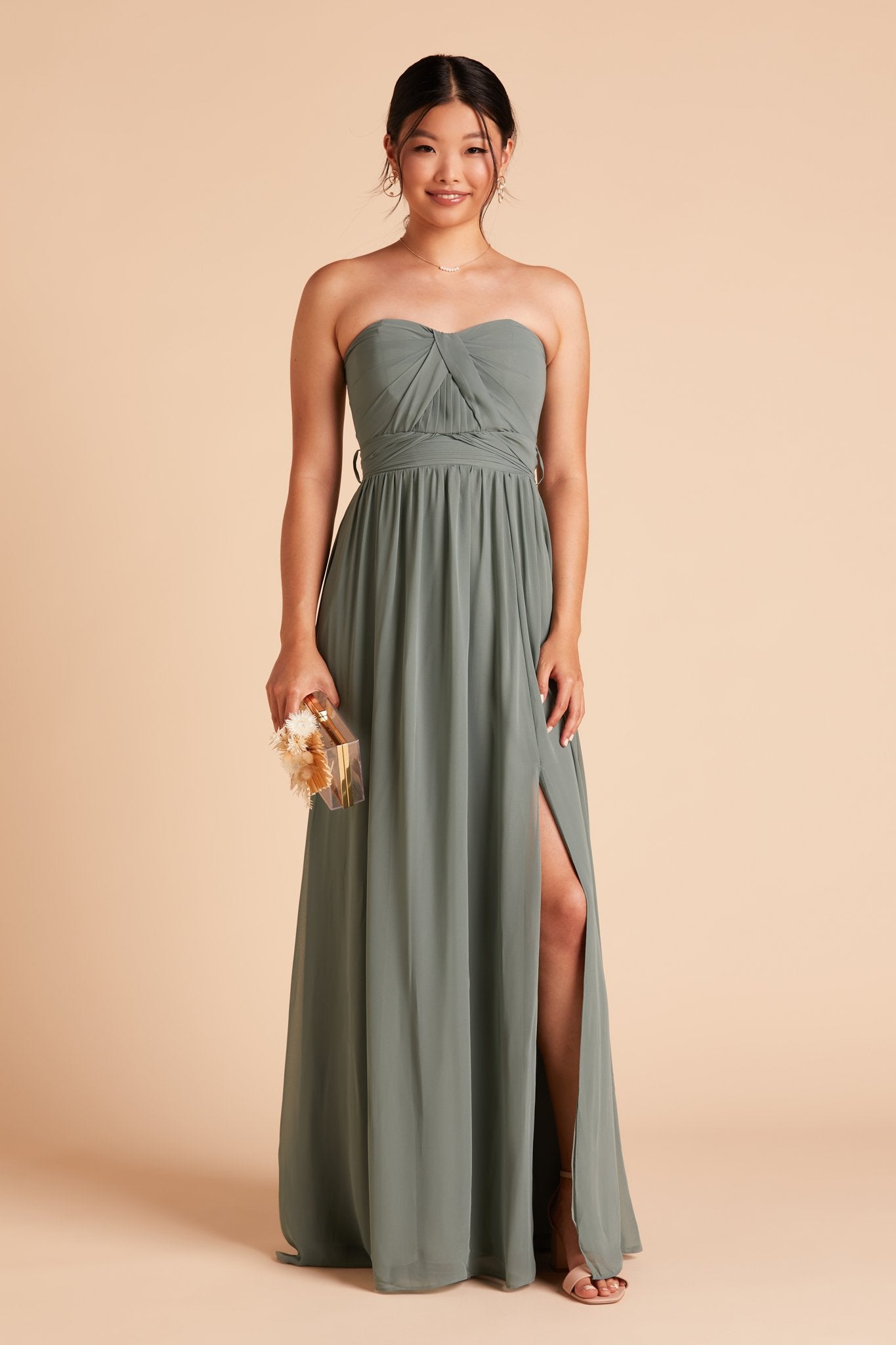 Front view of the floor-length Grace Convertible Bridesmaid Dress in sea glass chiffon features an optional slit in the flowing floor-length skirt over the left leg.
