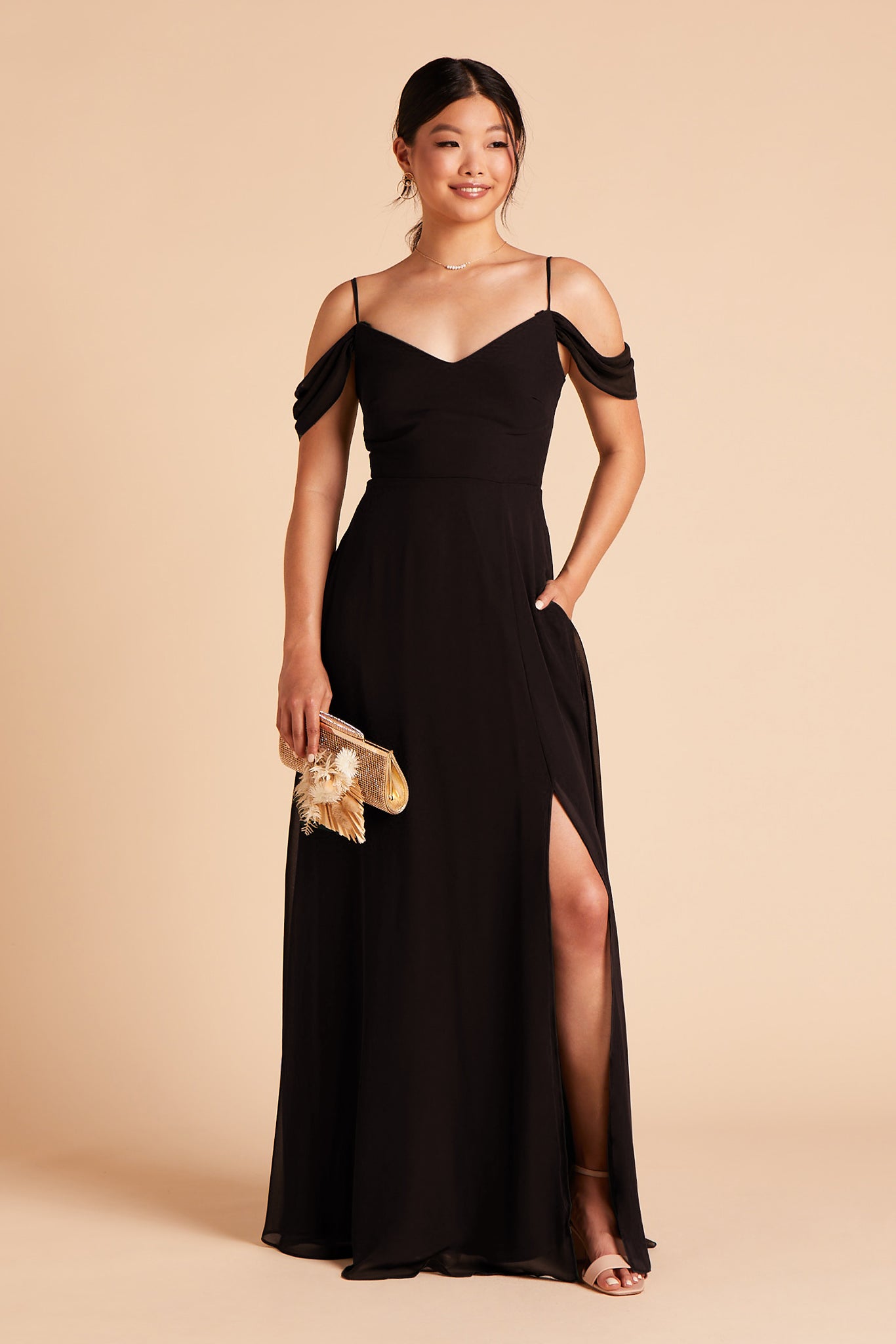 Long floor-sweeping black chiffon bridesmaid dress with slit and a V-neckline and sleeves