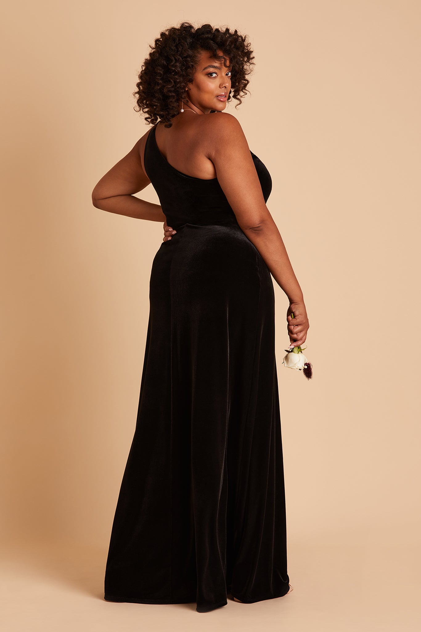 Kira plus size bridesmaid dress with slit in black velvet by Birdy Grey, side view