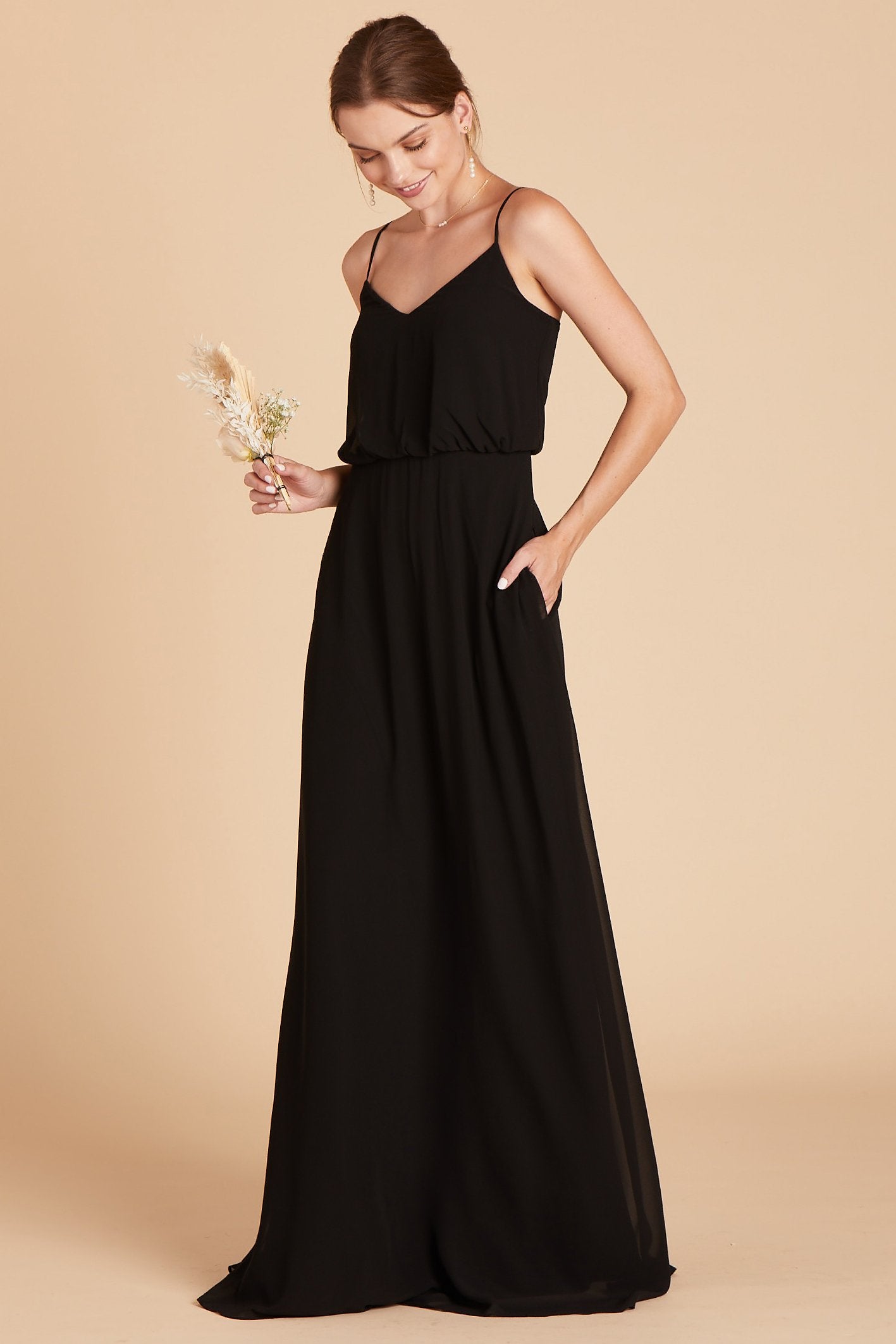 Gwennie bridesmaid dress in black chiffon by Birdy Grey, front view with hand in pocket