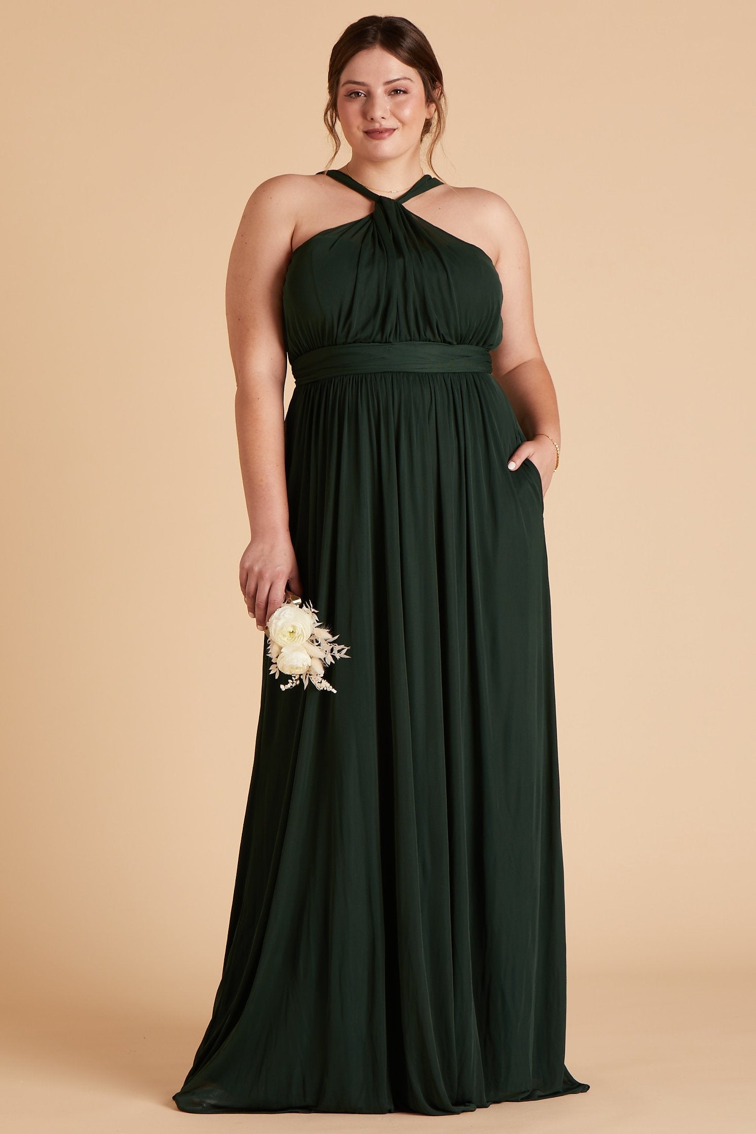 Kiko plus size bridesmaid dress in emerald green chiffon by Birdy Grey, front view with hand in pocket