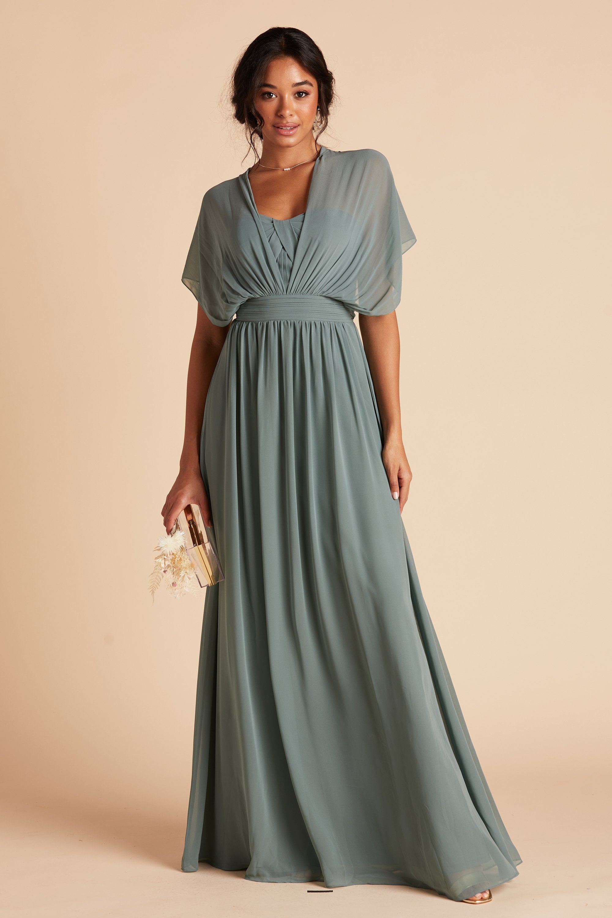 Front view of the Grace Convertible Dress in sea glass chiffon with the front streamers pulled over each shoulder and draped loosely around the model’s arms, creating a butterfly sleeve look.