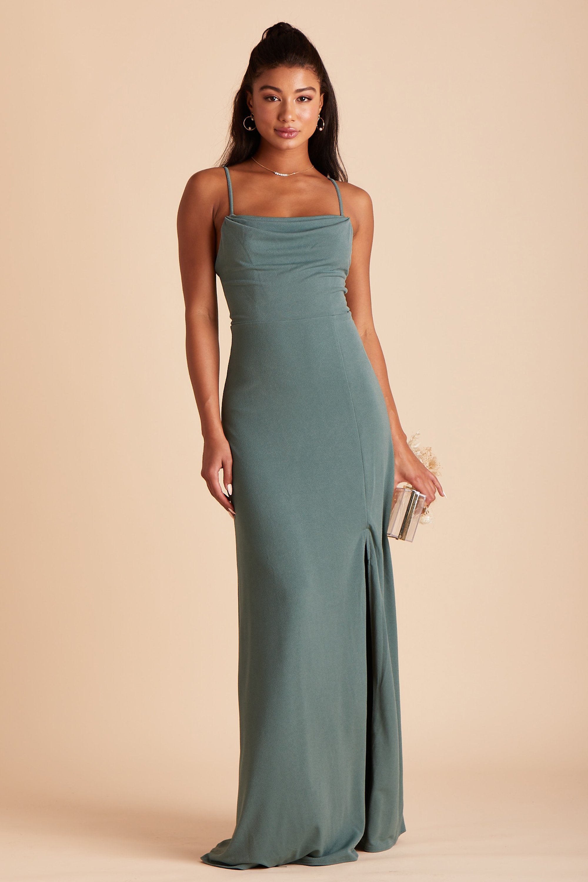 Front view of the floor-length Ash Bridesmaid Dress in sea glass crepe worn by a model who is slender with medium skin tone. 