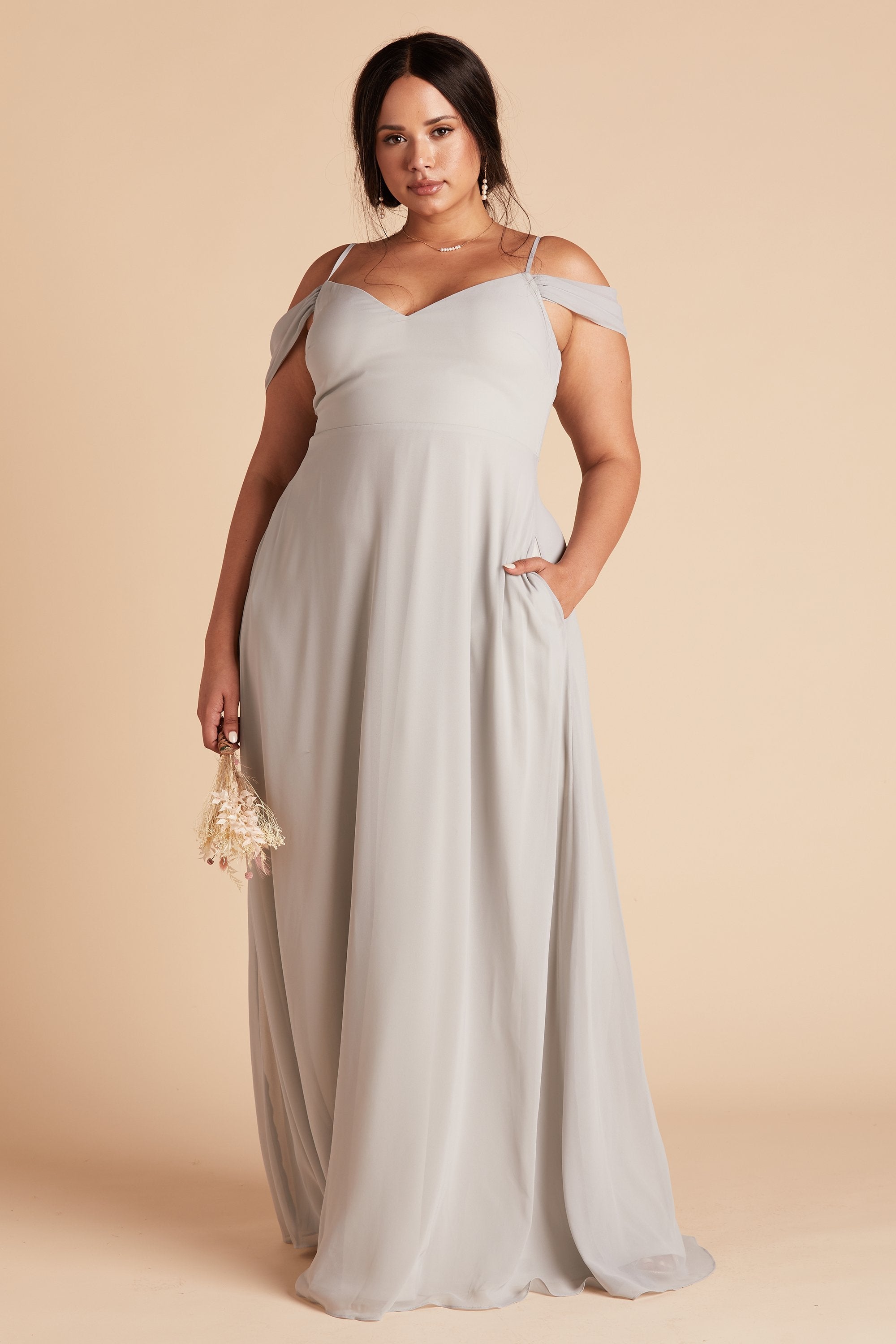 Devin convertible plus size bridesmaid dress in dove gray chiffon by Birdy Grey, front view with hand in pocket