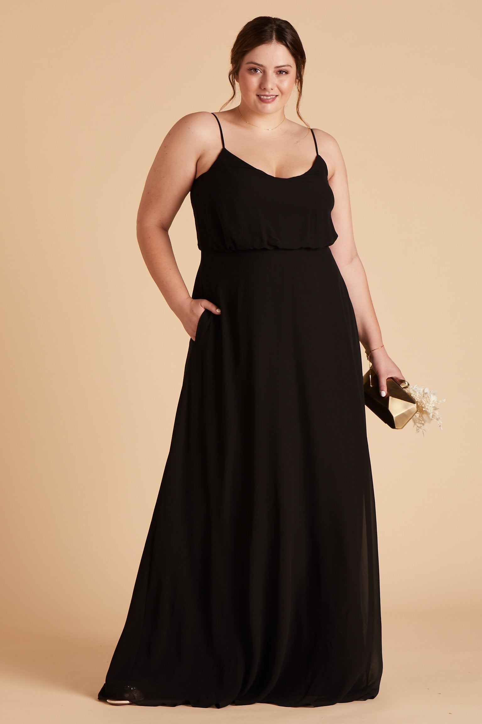 Gwennie plus size bridesmaid dress in black chiffon by Birdy Grey, front view with hand in pocket