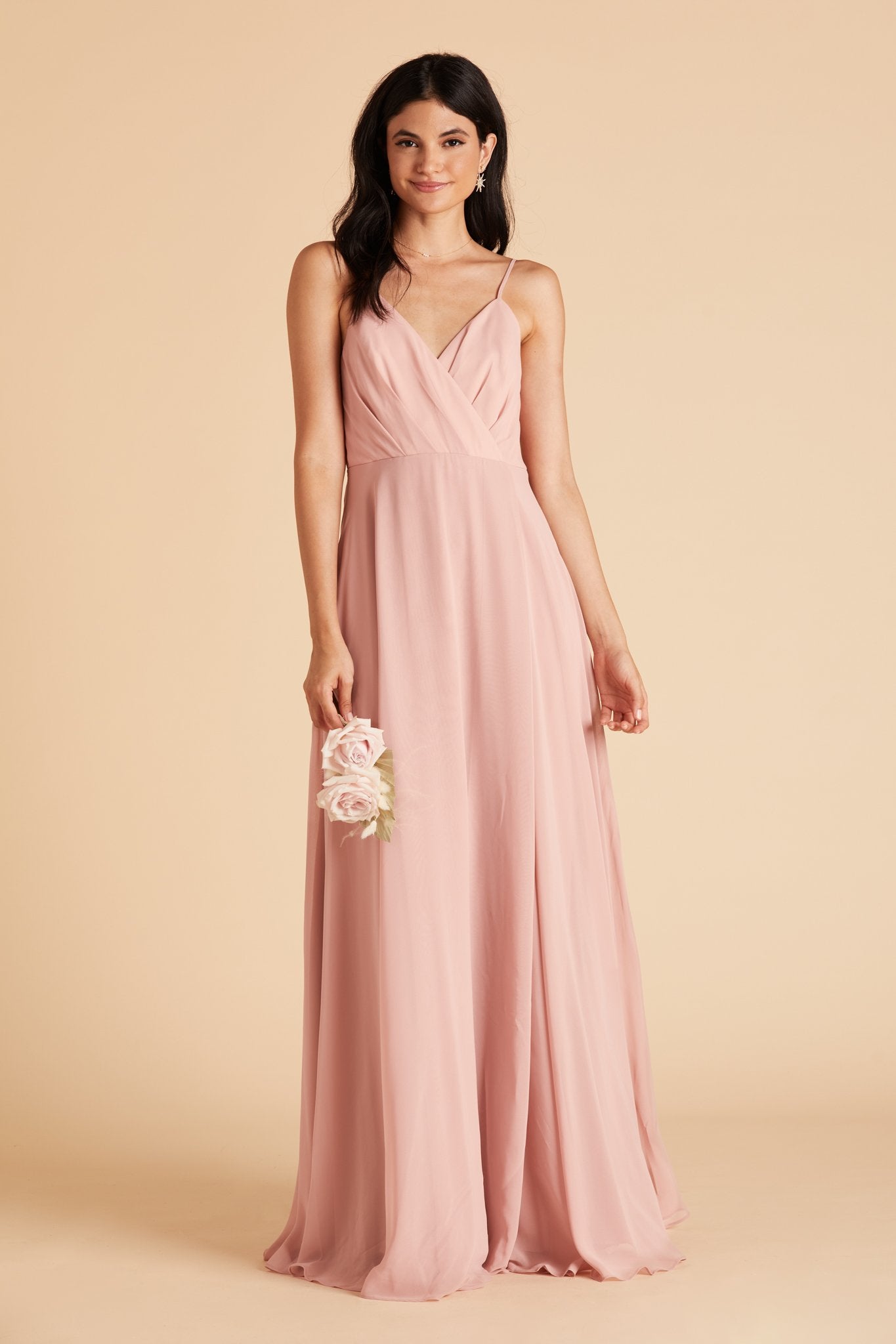 Front view of the Kira Dress in dusty rose chiffon worn by a slender model with a light skin tone. 