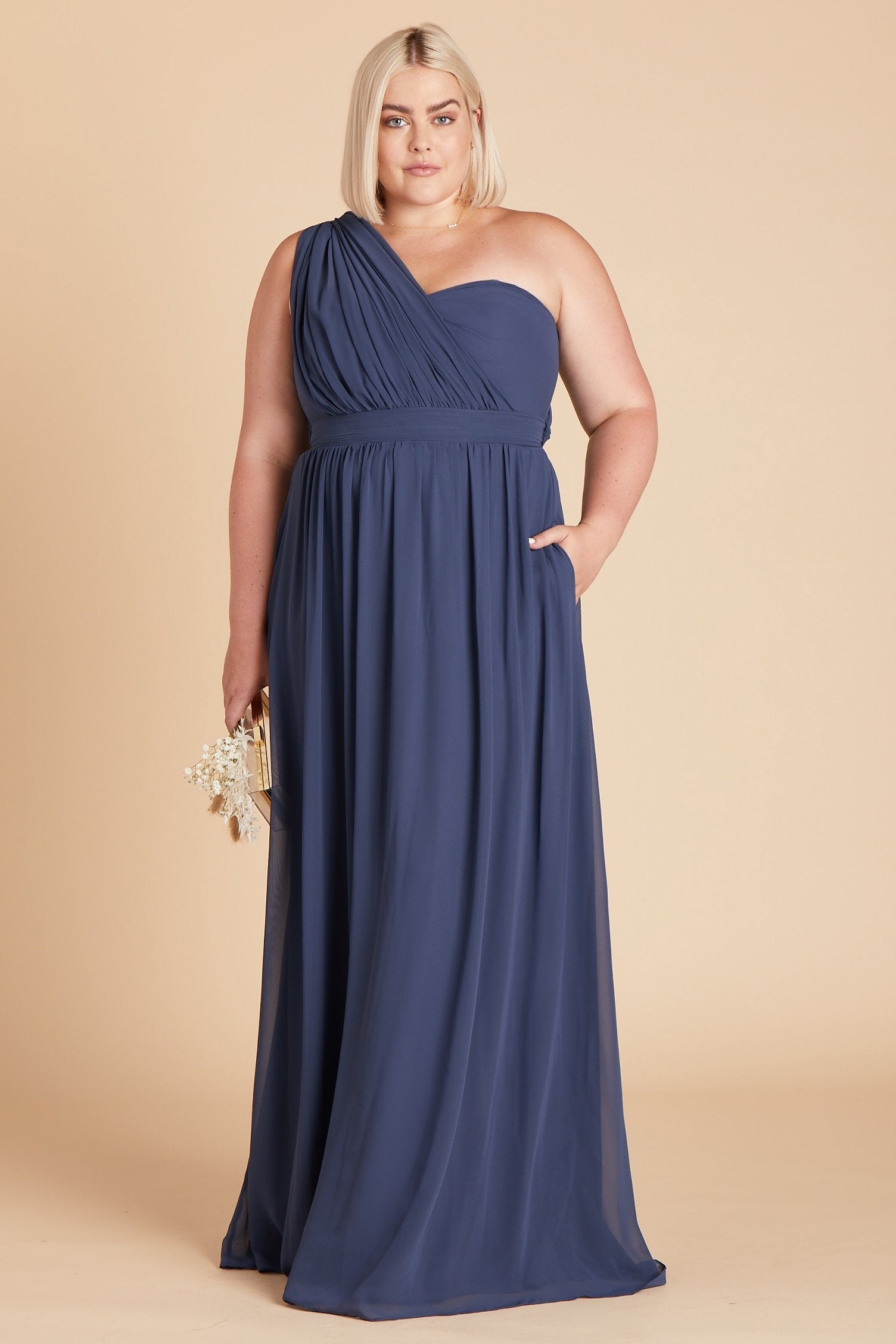 Grace convertible plus size bridesmaid dress in slate blue chiffon by Birdy Grey, front view with hand in pocket
