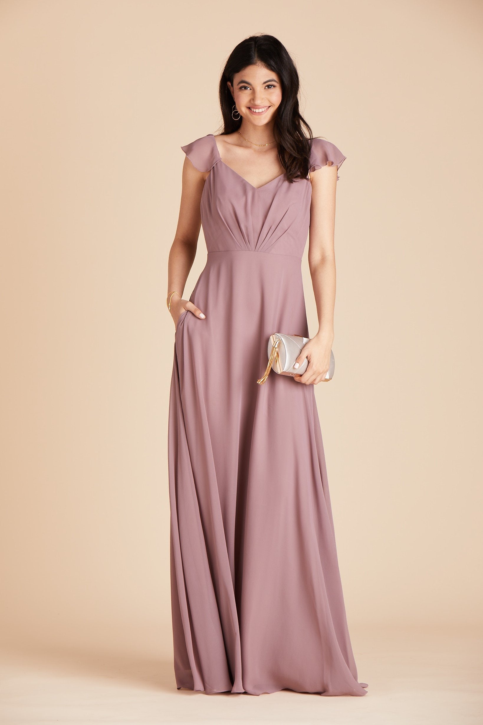 Kae bridesmaids dress in dark mauve purple chiffon by Birdy Grey, front view with hand in pocket
