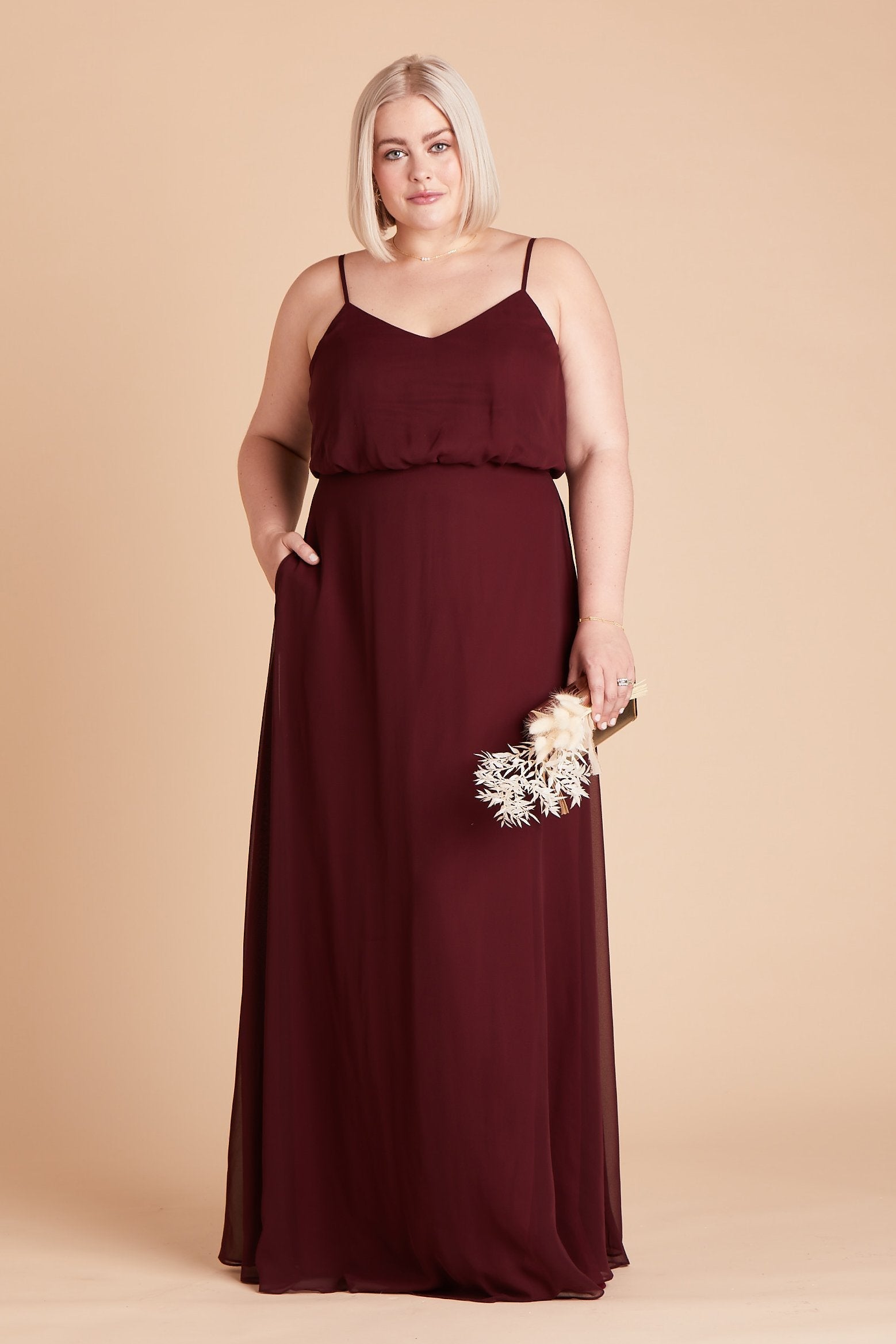 Gwennie plus size bridesmaid dress in cabernet burgundy chiffon by Birdy Grey, front view with hand in pocket