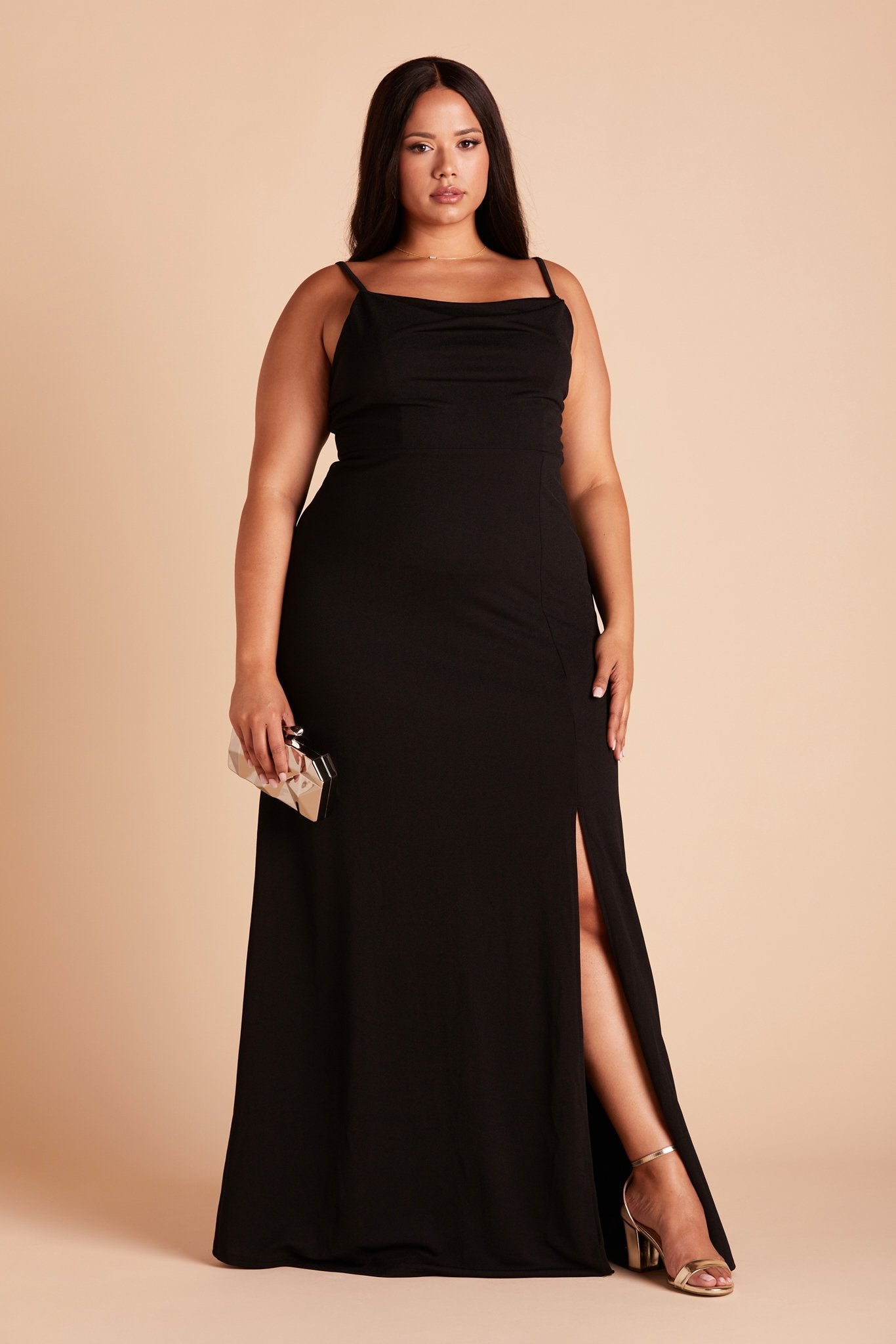 Front view of the floor-length Ash Bridesmaid Dress Curve in black crepe worn by a curvy model with medium-tone skin.
