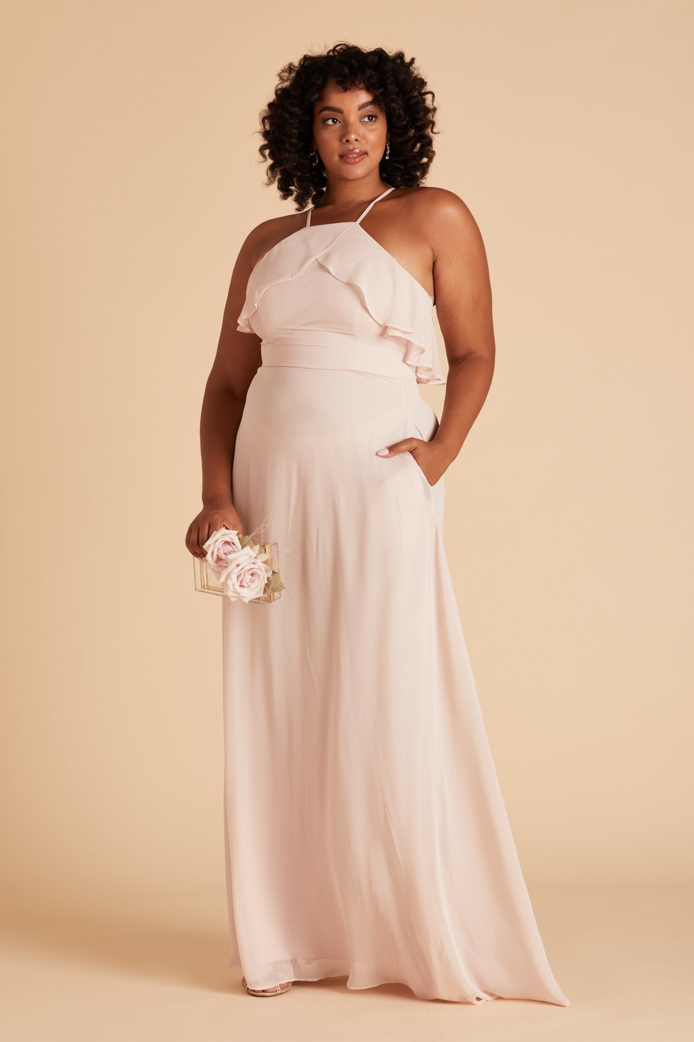 Jules plus size bridesmaid dress in pale blush chiffon by Birdy Grey, front view with hand in pocket