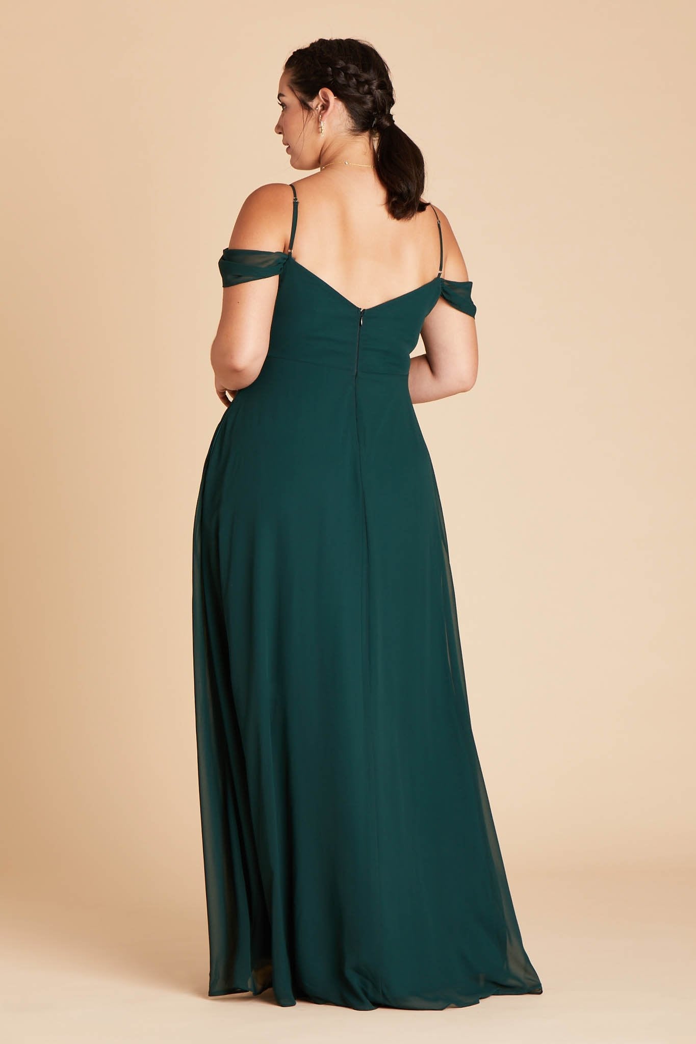 Back view of the floor-length Devin Convertible Plus Size Bridesmaid Dress in emerald chiffon displays adjustable spaghetti straps and an open back with a slight v-cut just below the shoulder blades.