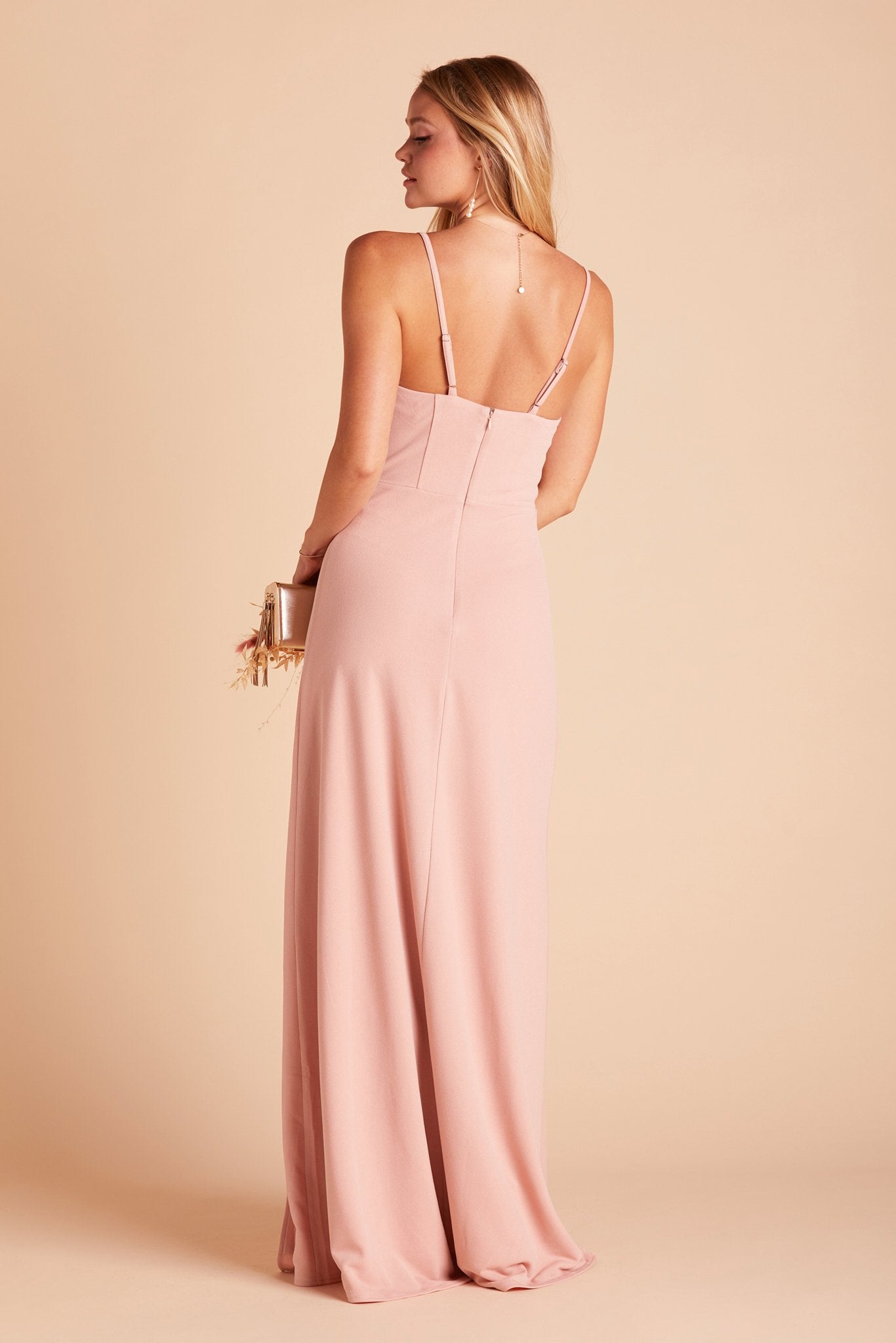 Back view of the Ash Bridesmaid Dress in dusty rose crepe shows skinny adjustable straps as well as an open back just below shoulder blades.