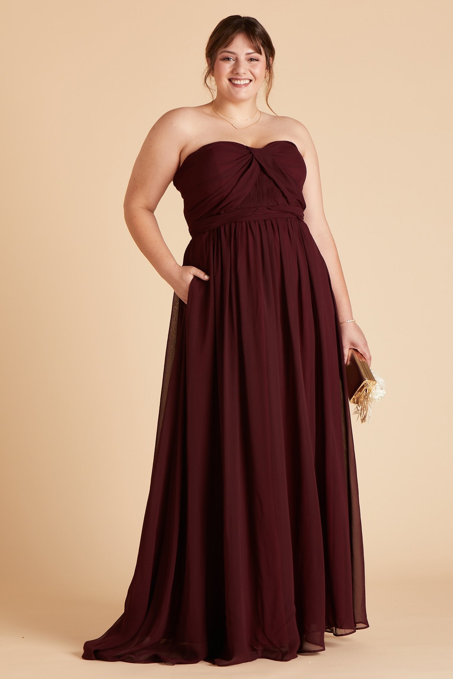 Grace convertible plus size bridesmaid dress in cabernet burgundy chiffon by Birdy Grey, front view with hand in pocket
