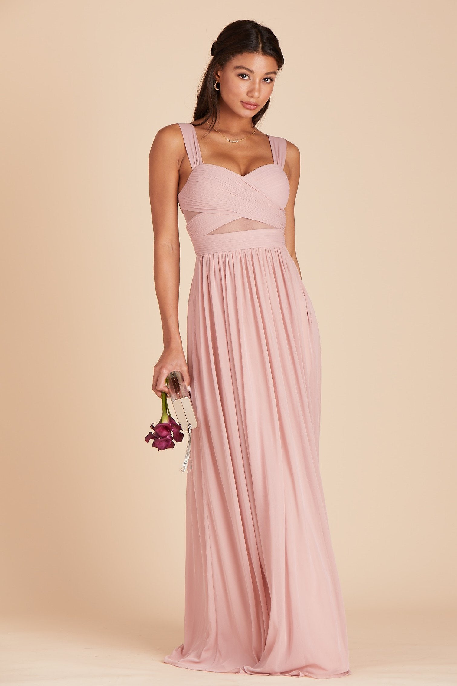 Front view of the floor-length Elsye Bridesmaid Dress in dusty rose mesh by Birdy Grey features a sweetheart neckline and wide straps with a crisscross bust and peekaboo mesh cutouts.