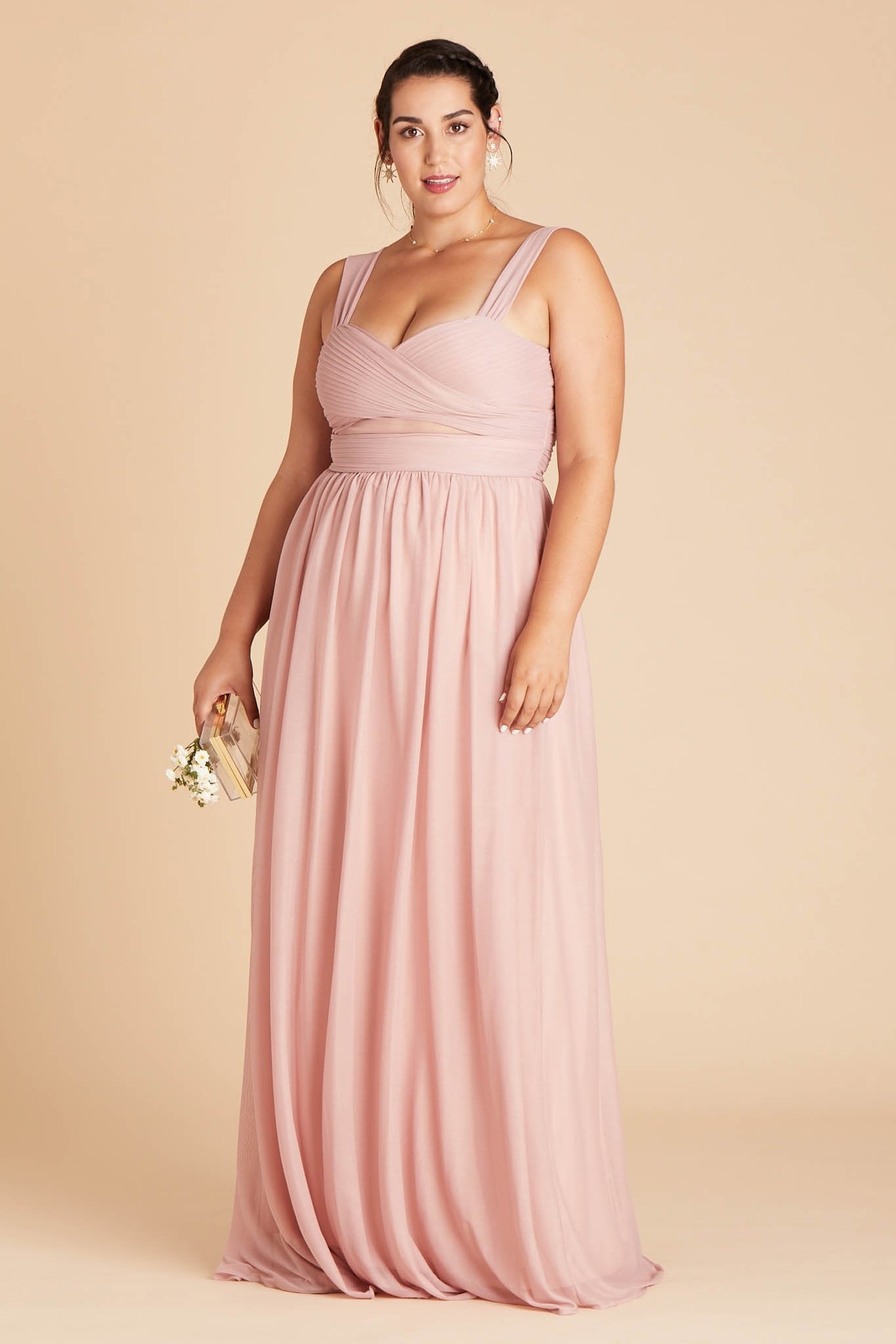 Front view of the Elsye Plus Size Bridesmaid Dress in dusty rose mesh worn by a curvy model with a light skin tone.