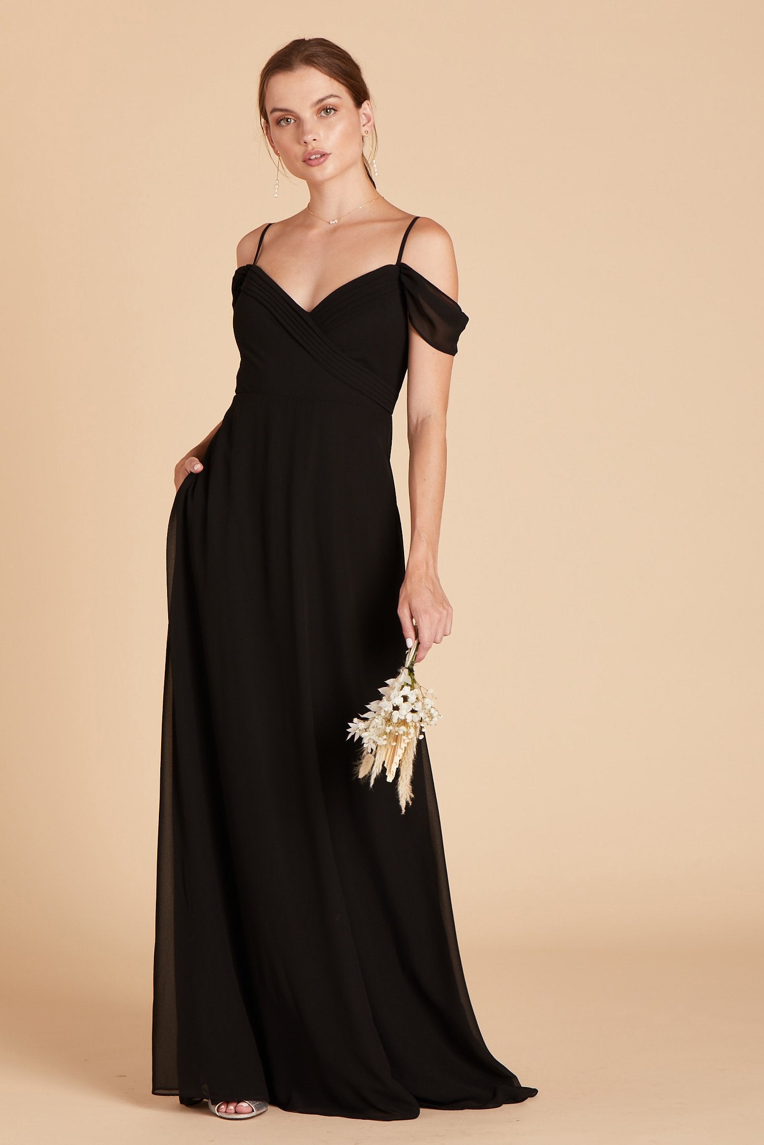 Spence convertible bridesmaid dress in black chiffon by Birdy Grey, front view with hand in pocket 