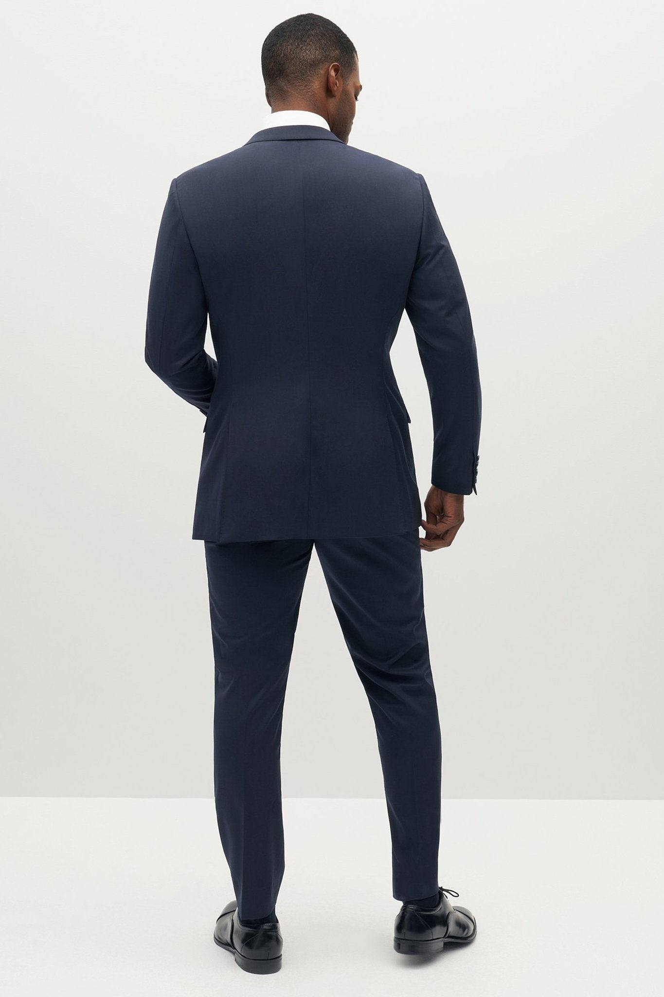 Navy Blue Groomsmen Suit by SuitShop, back view