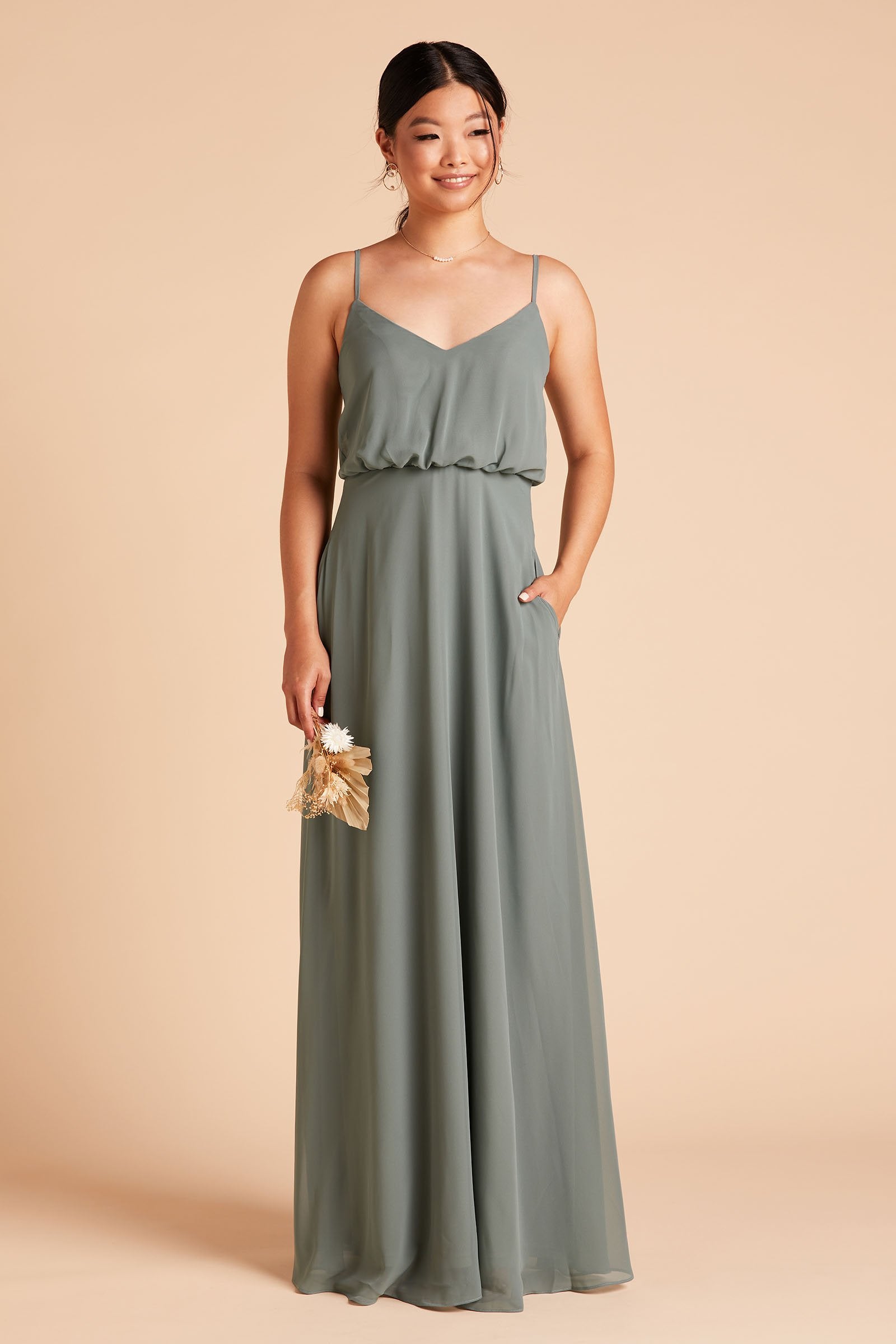 Gwennie bridesmaid dress in sea glass green chiffon by Birdy Grey, front view with hand in pocket