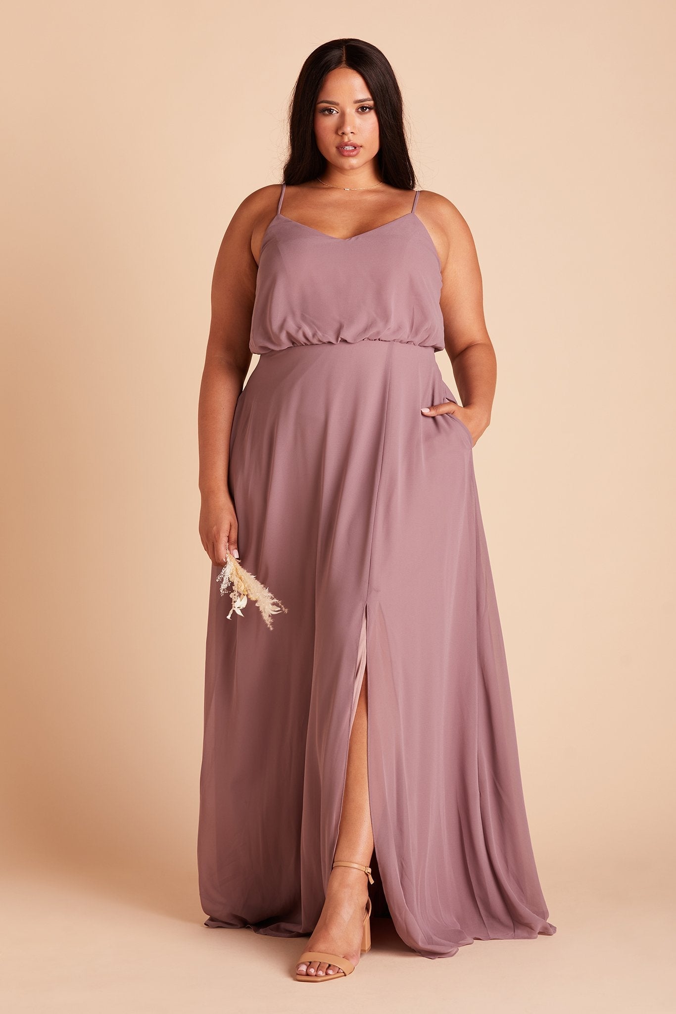 Gwennie plus size bridesmaid dress with slit in dark mauve chiffon by Birdy Grey, front view with hand in pocket