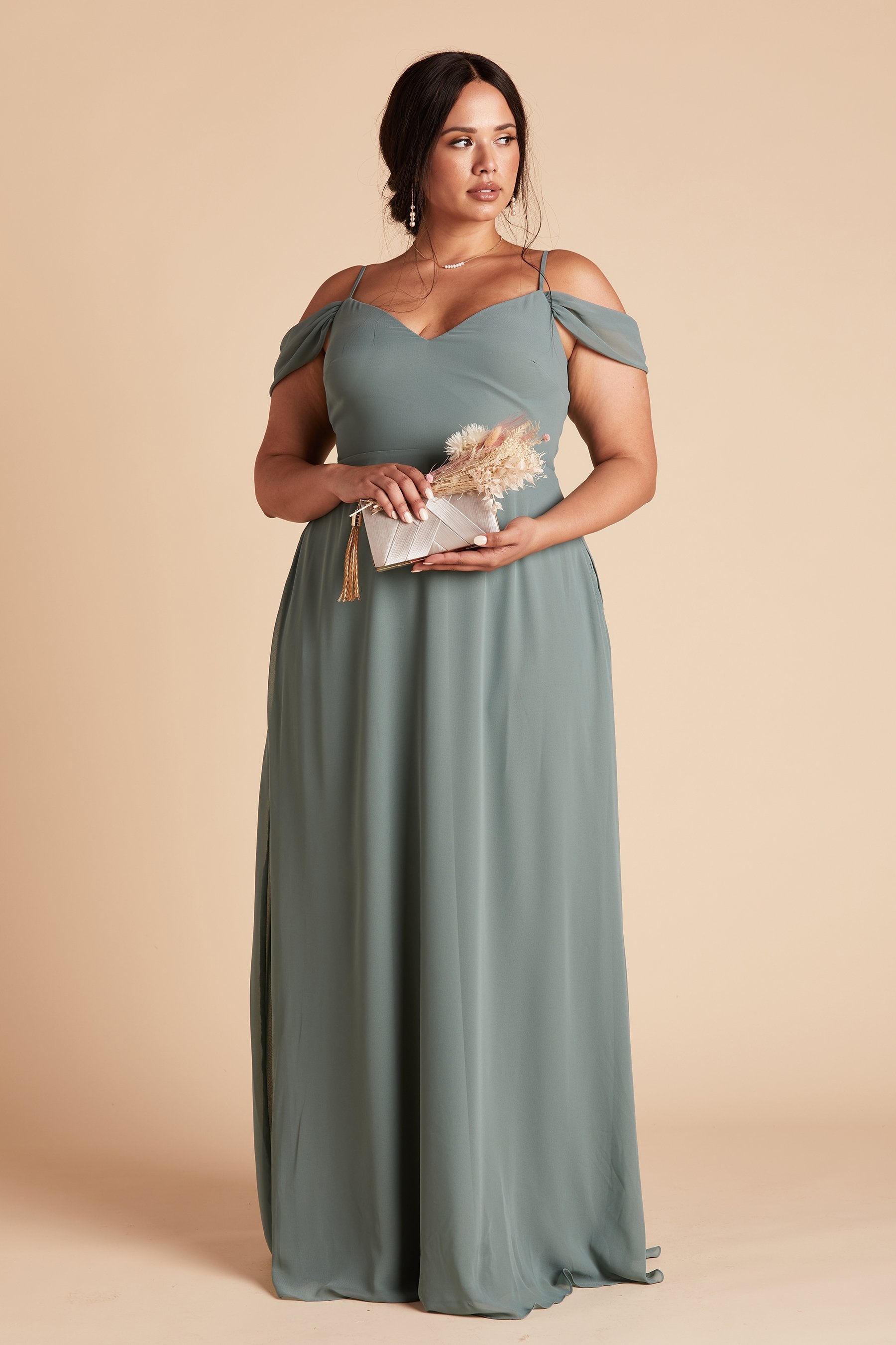 Front view of the Devin Convertible Dress Curve in sea glass chiffon worn by a full-figured model with a light skin tone. 