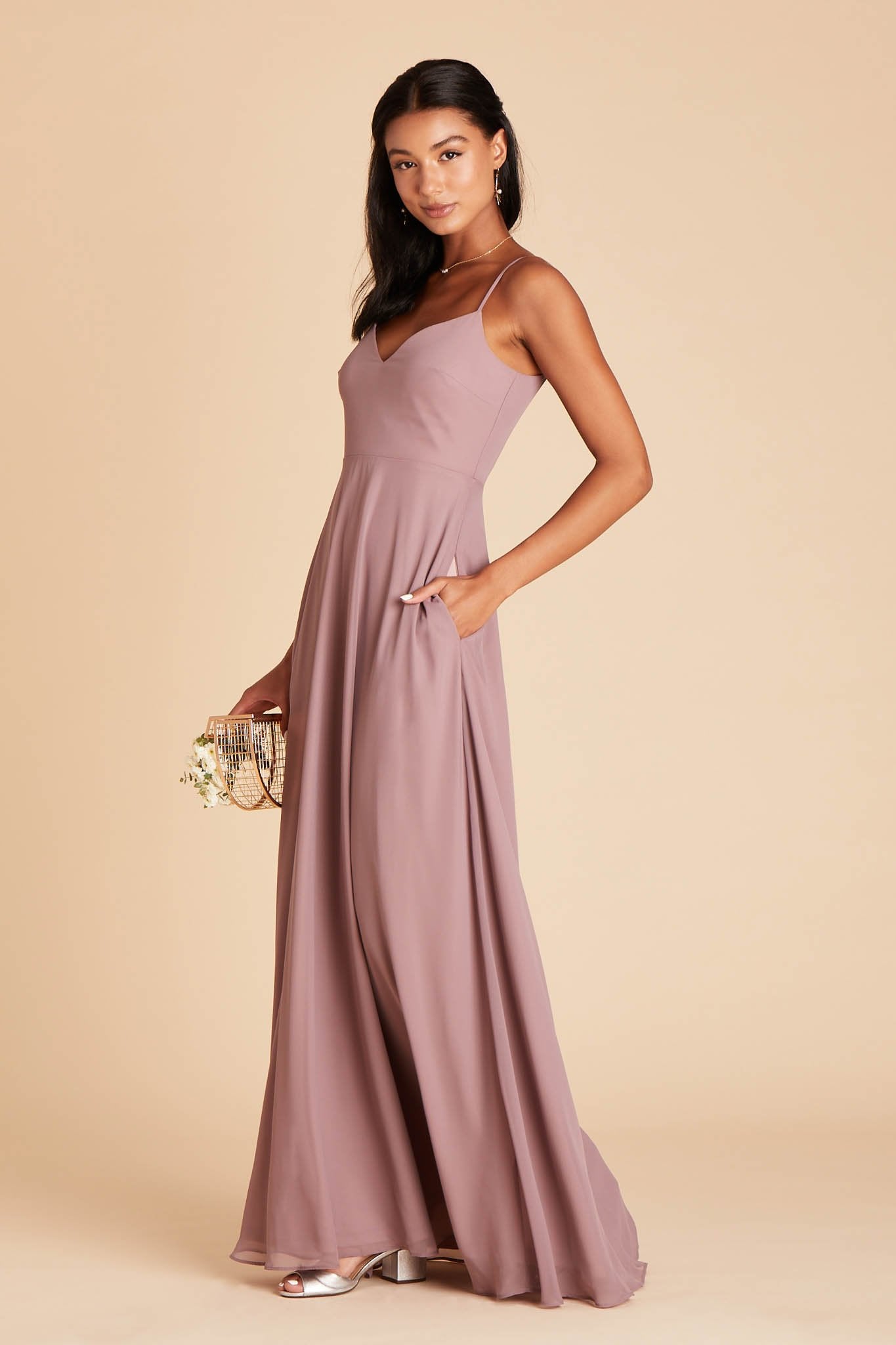 Devin convertible bridesmaid dress in dark mauve chiffon by Birdy Grey, side view with hand in pocket