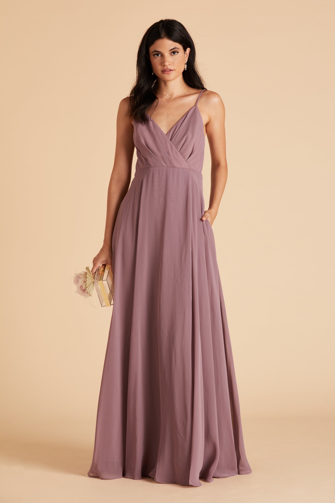 Kaia bridesmaids dress in dark mauve purple chiffon by Birdy Grey, front view with hand in pocket