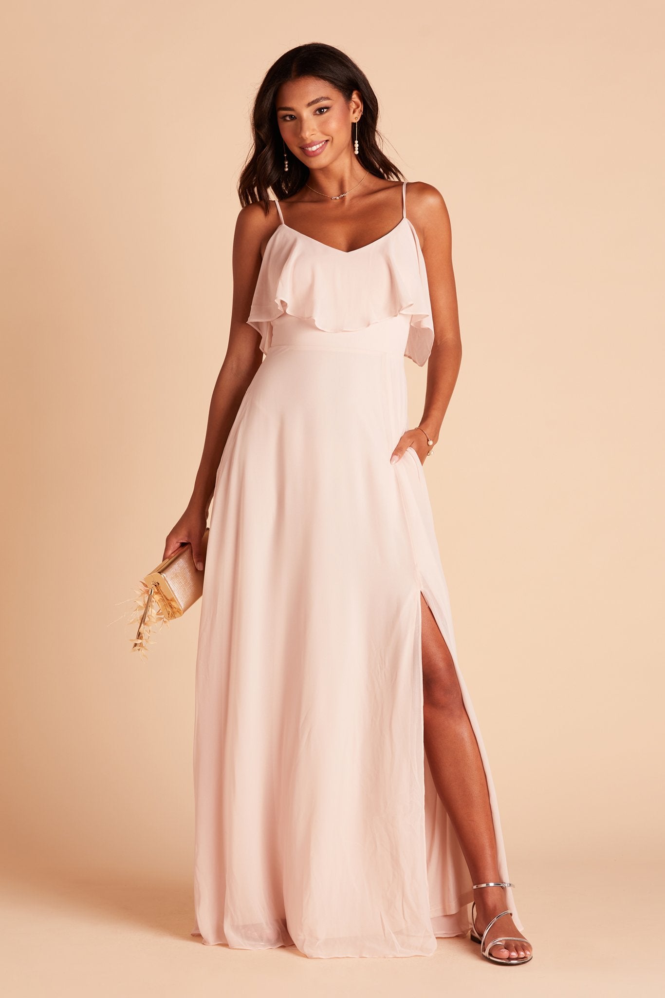 Jane convertible bridesmaid dress with slit in pale blush chiffon by Birdy Grey, front view with hand in pocket