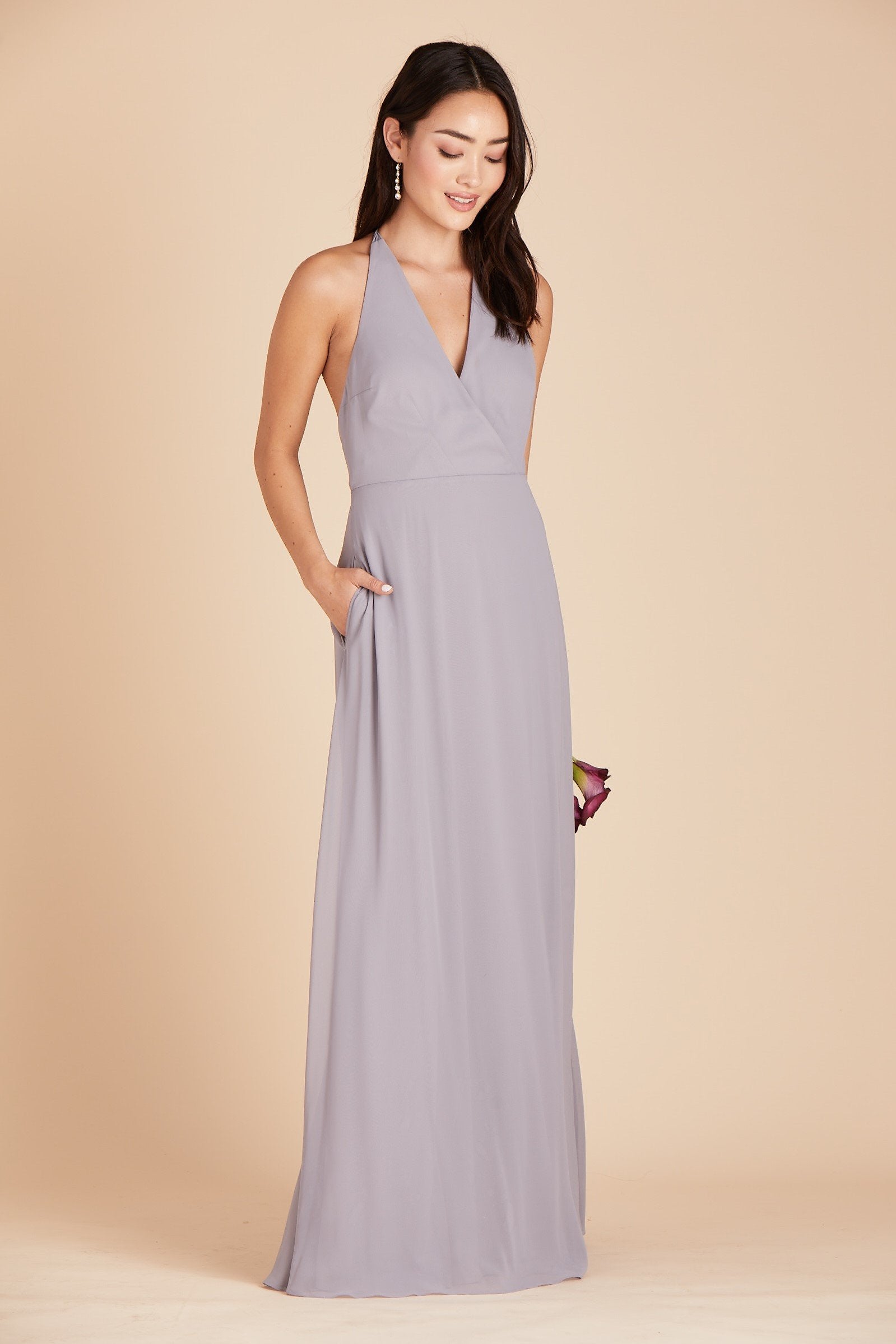 Moni convertible bridesmaids dress in silver chiffon by Birdy Grey, front view with hand in pocket