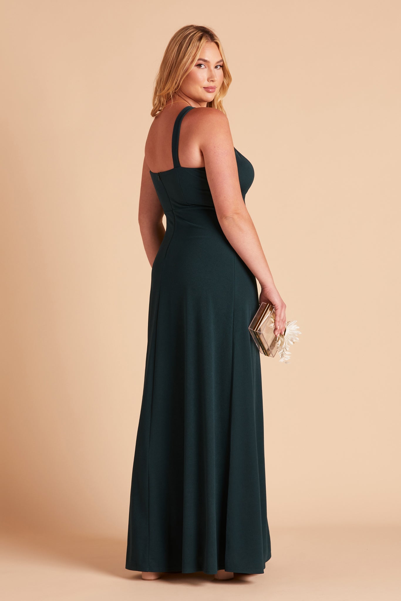 Gene plus size bridesmaid dress with slit in emerald green crepe by Birdy Grey, side view