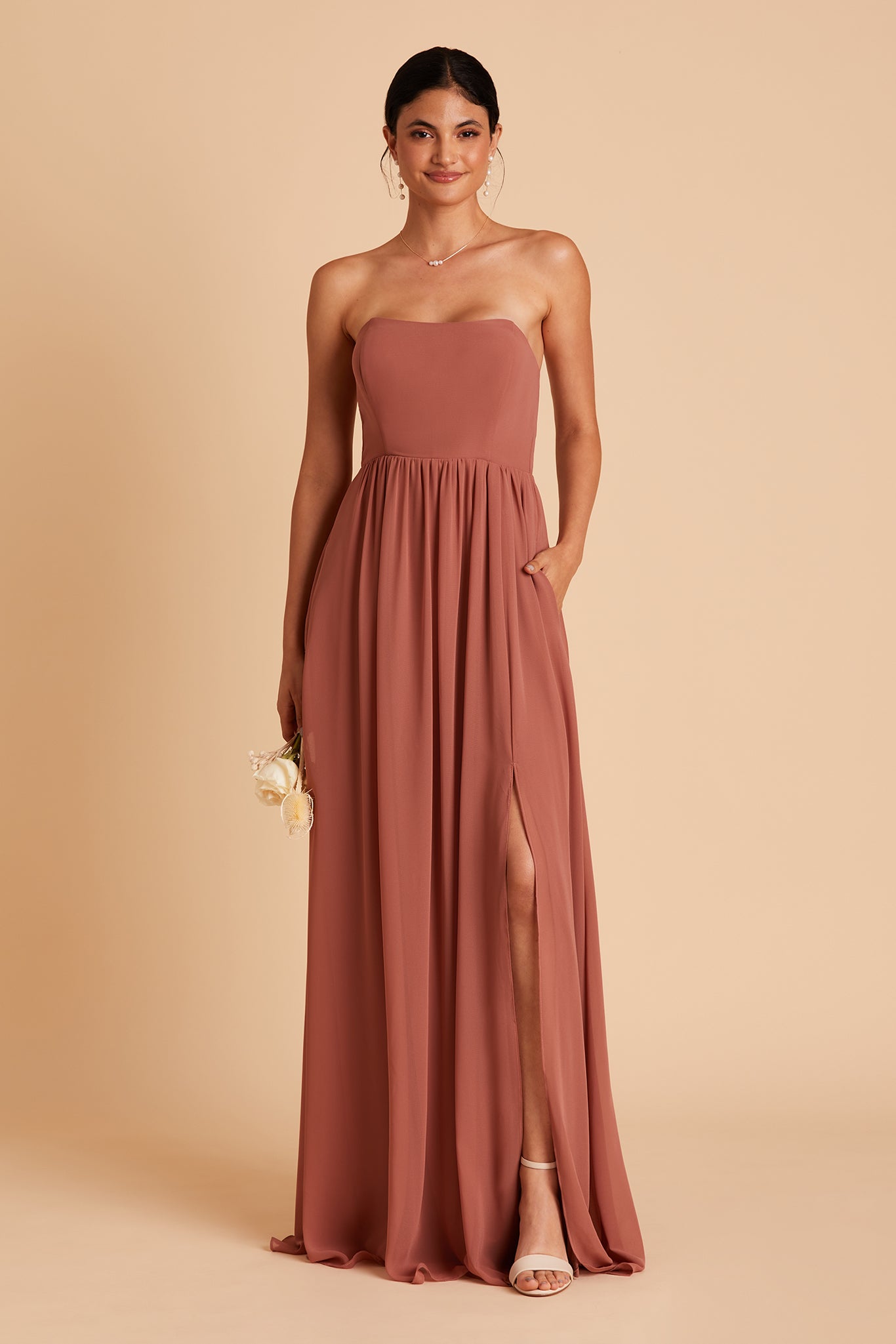 August bridesmaid dress with slit in desert rose chiffon by Birdy Grey, front view