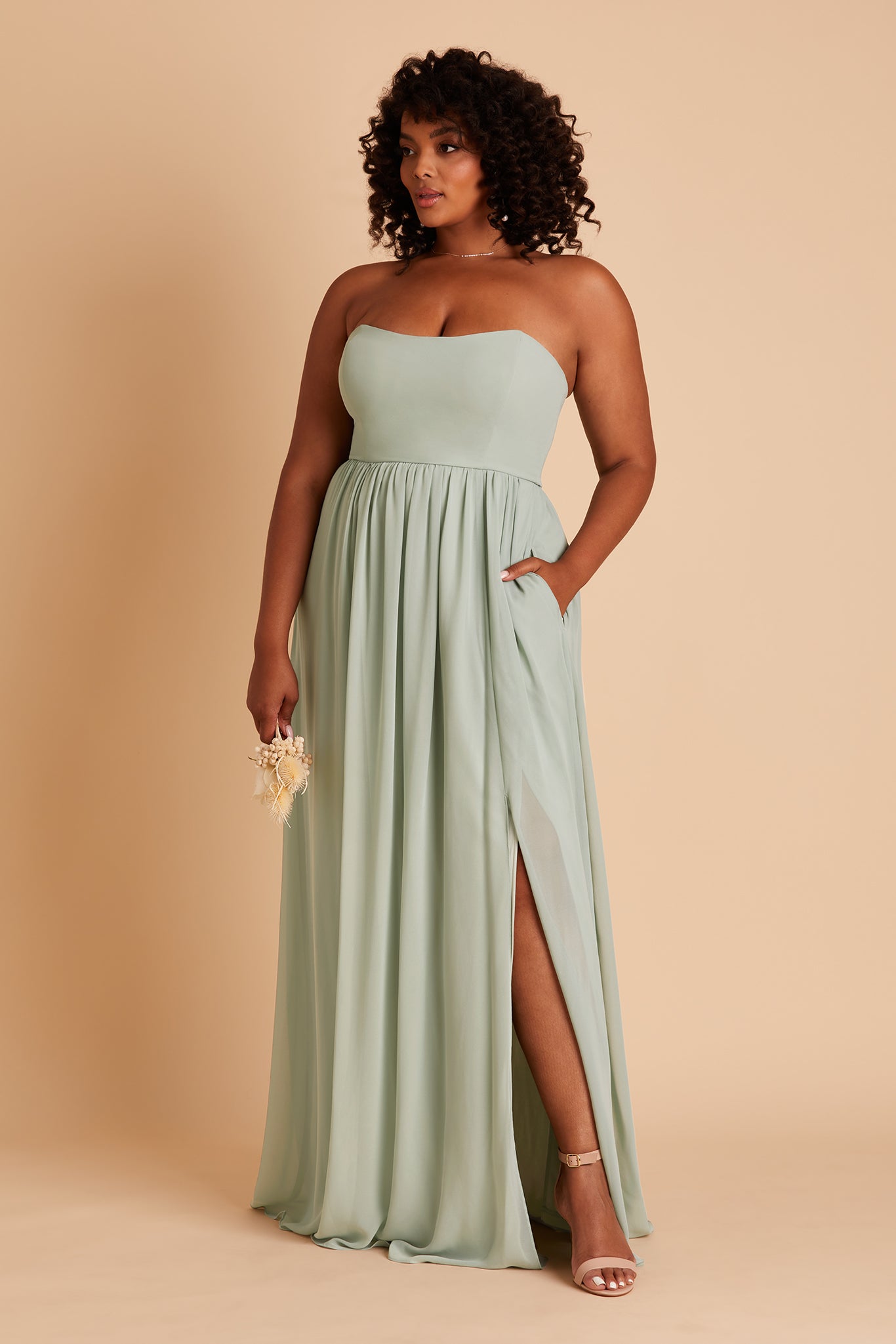 August plus size bridesmaid dress with slit in sage chiffon by Birdy Grey, front view