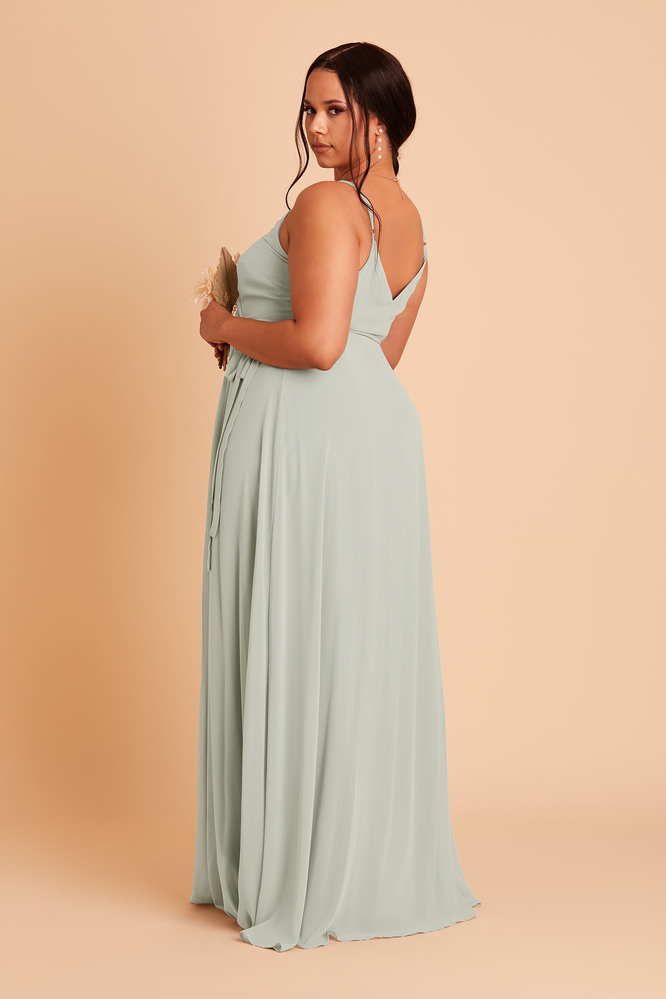 Back view of the Cindy Plus Size Bridesmaid Dress in sage chiffon reveals adjustable spaghetti straps and a V-shaped cut over the shoulder blades.