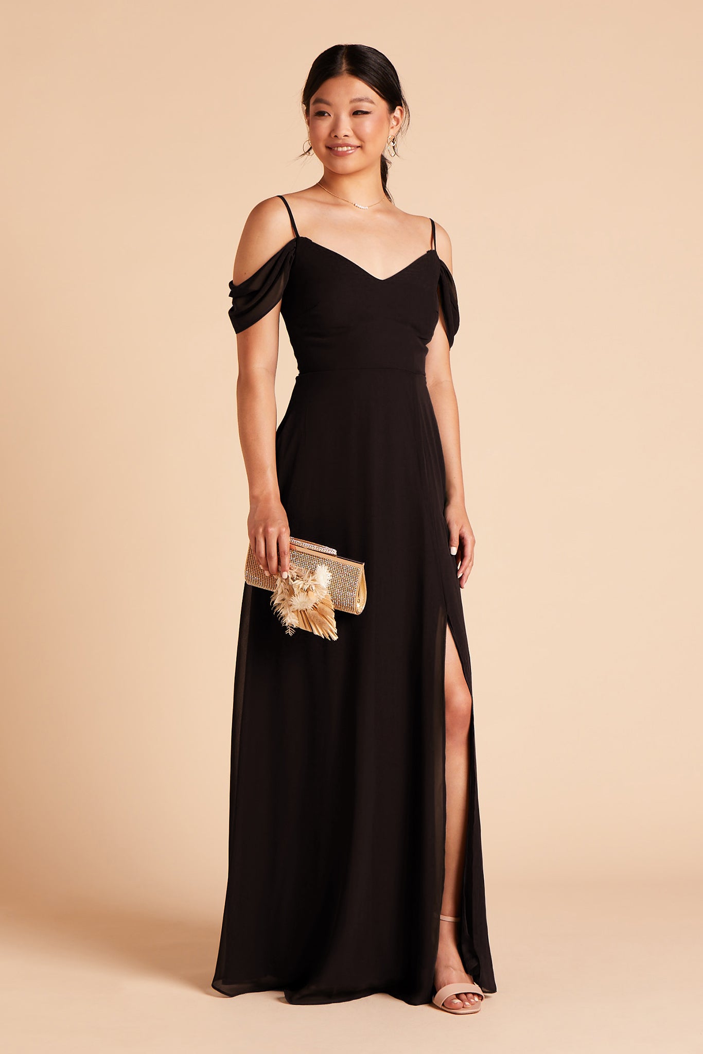 Long floor-sweeping black chiffon bridesmaid dress with slit and a V-neckline and sleeves