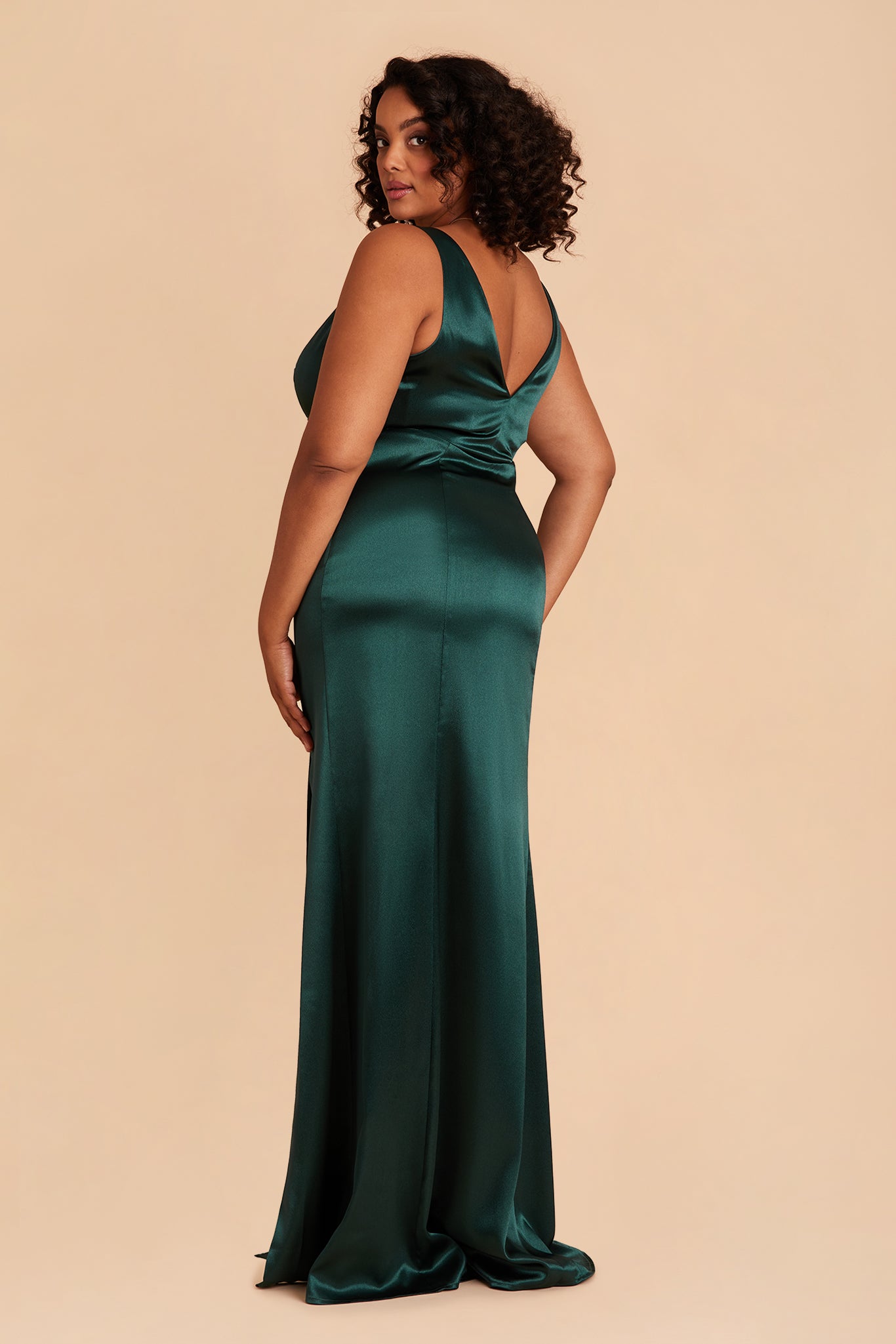 Gloria plus size bridesmaid dress with slit in emerald satin by Birdy Grey, side view