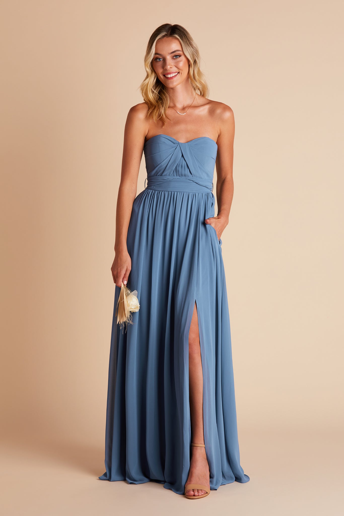 Grace convertible bridesmaid dress with slit in twilight blue chiffon by Birdy Grey, front view with hand in pocket