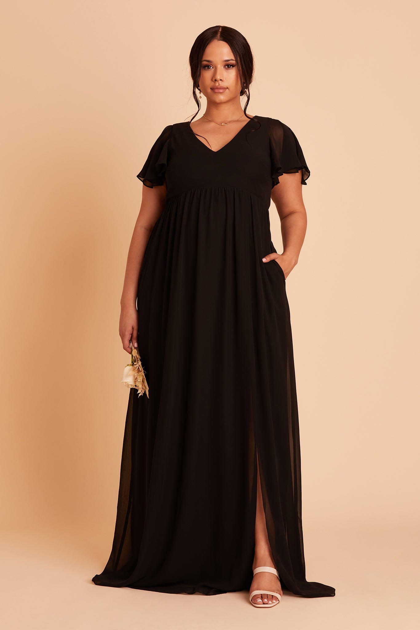 Hannah empire plus size bridesmaid dress in black chiffon by Birdy Grey, front view, hand in pocket