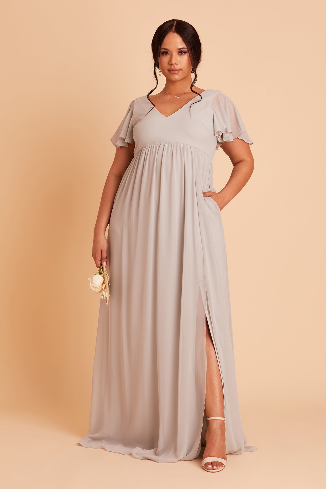 Hannah empire plus size bridesmaid dress in dove gray chiffon by Birdy Grey, front view, hand in pocket