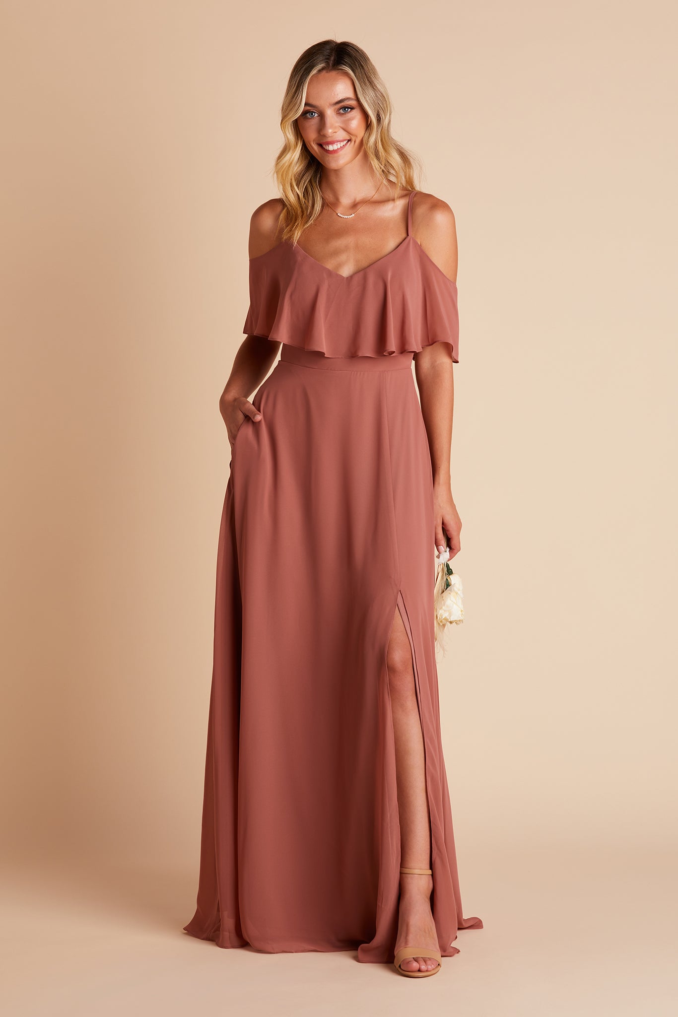Jane convertible bridesmaid dress with slit in desert rose chiffon by Birdy Grey, front view with hand in pocket