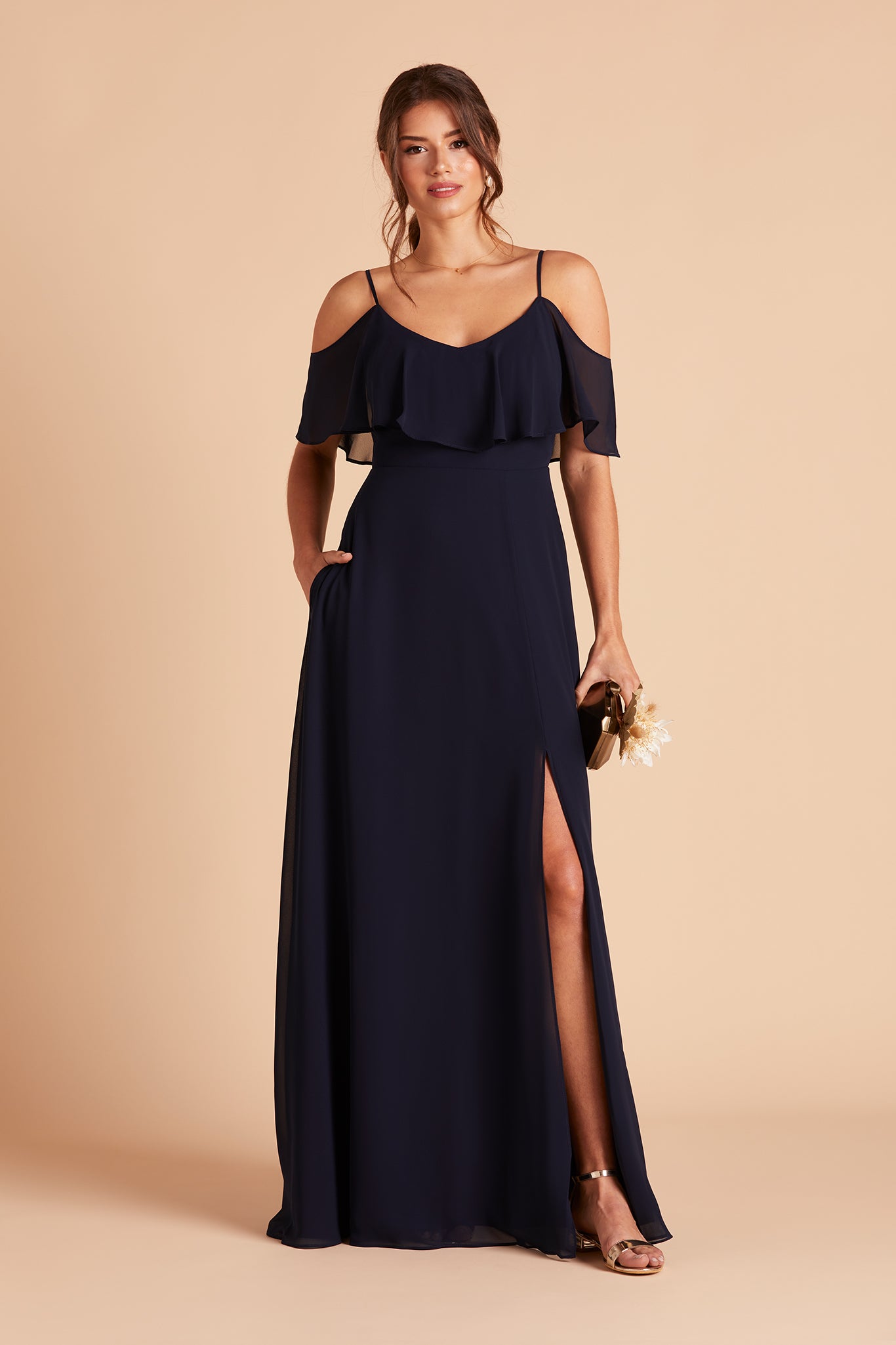 Jane convertible bridesmaid dress with slit in navy blue chiffon by Birdy Grey, front view with hand in pocket