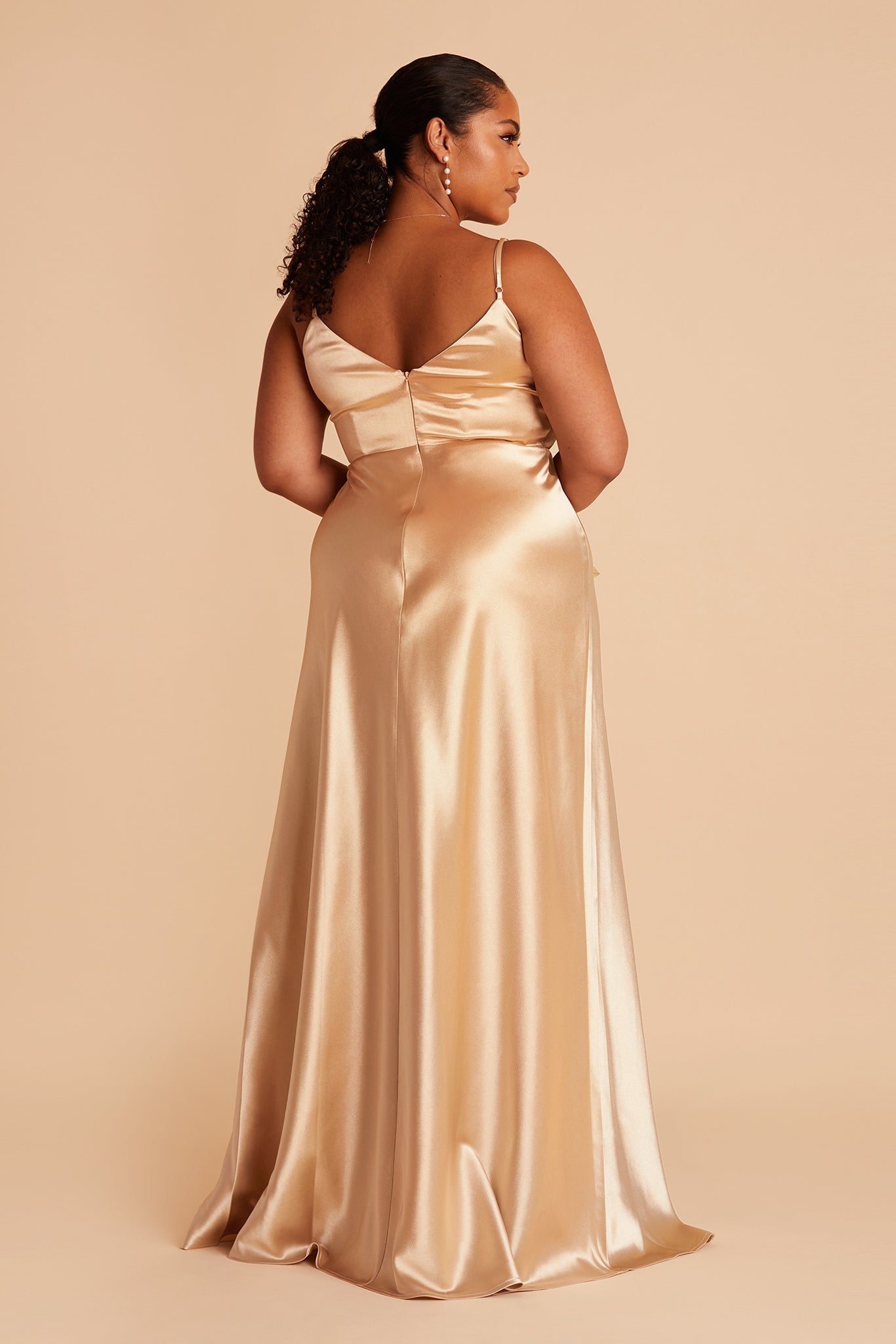 Back view of the Jay Plus Size Bridesmaid Dress in gold satin flaunts a V-shaped cut just under the shoulder blades and adjustable spaghetti straps.
