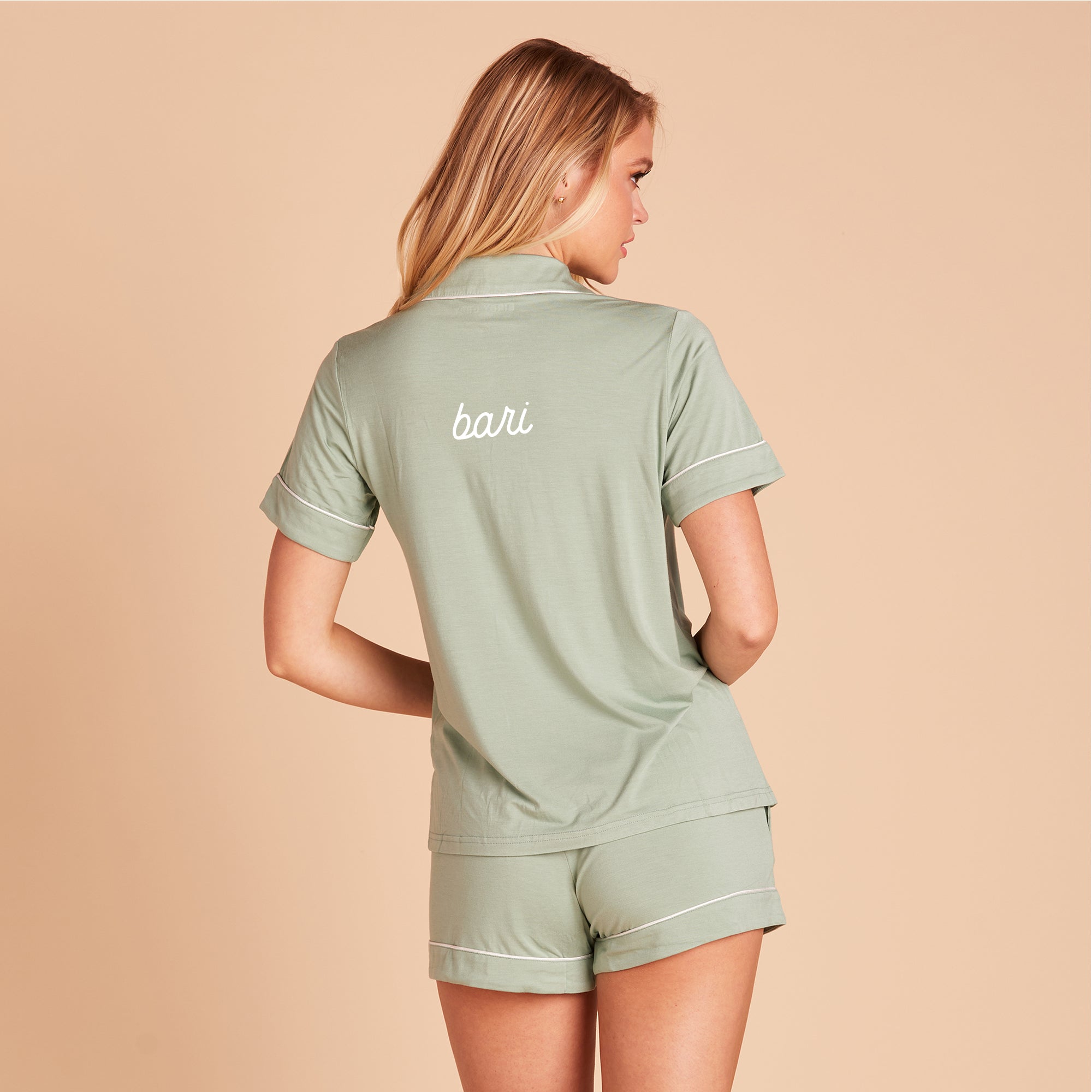 Back view of the Jonny Pajama Set in sage with embroidery personalization that reads “Bari” in cursive.