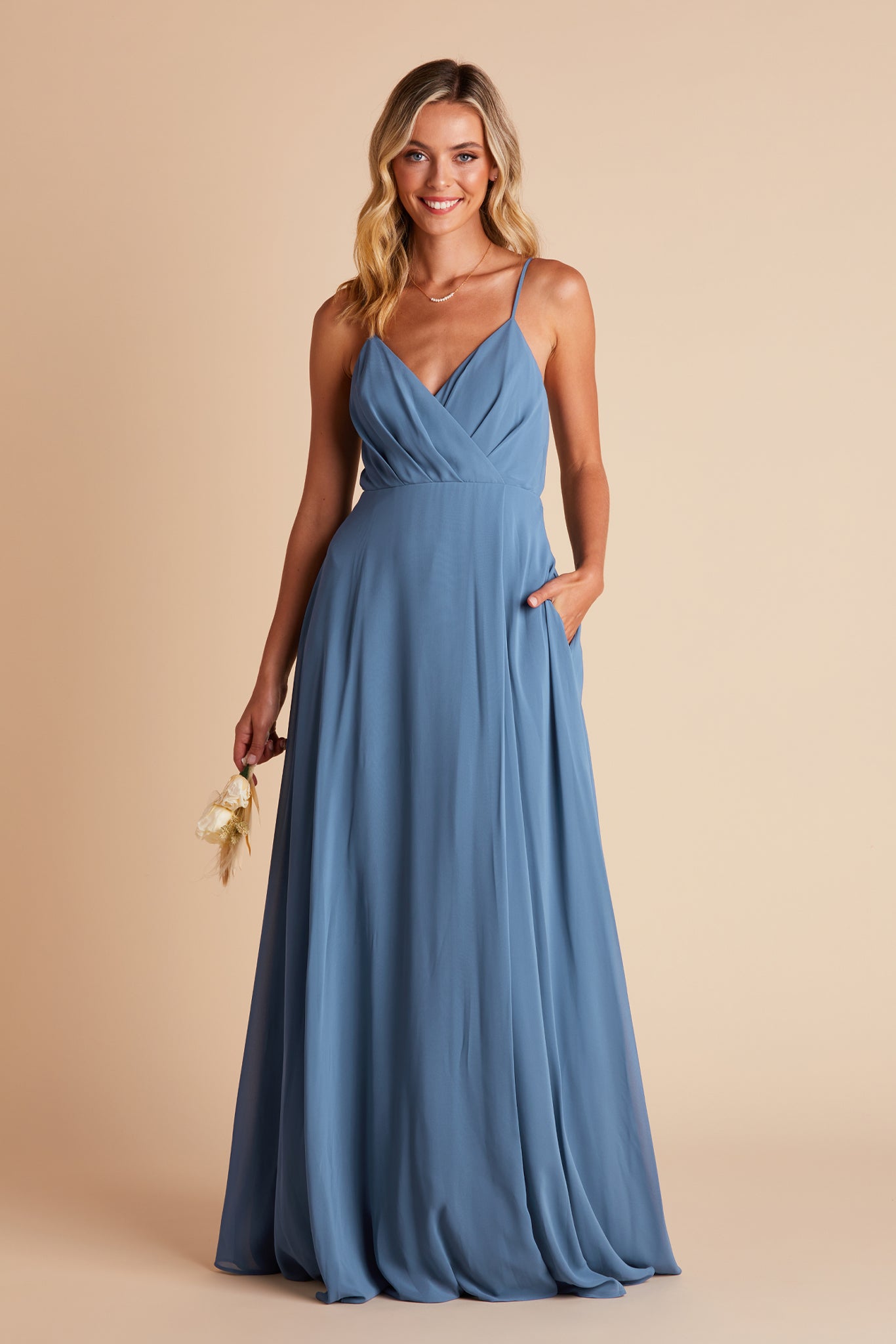 Kaia bridesmaids dress in twilight blue chiffon by Birdy Grey, front view with hand in pocket