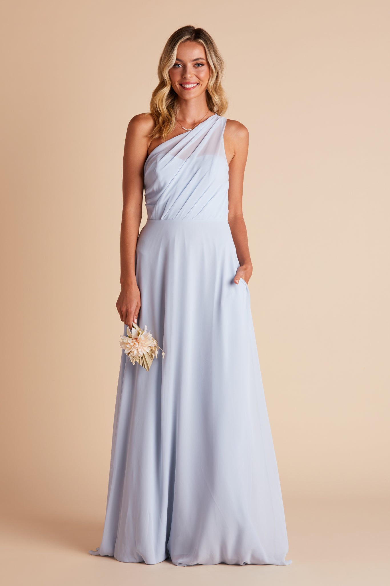 Kira bridesmaids dress in ice blue chiffon by Birdy Grey, front view with hand in pocket