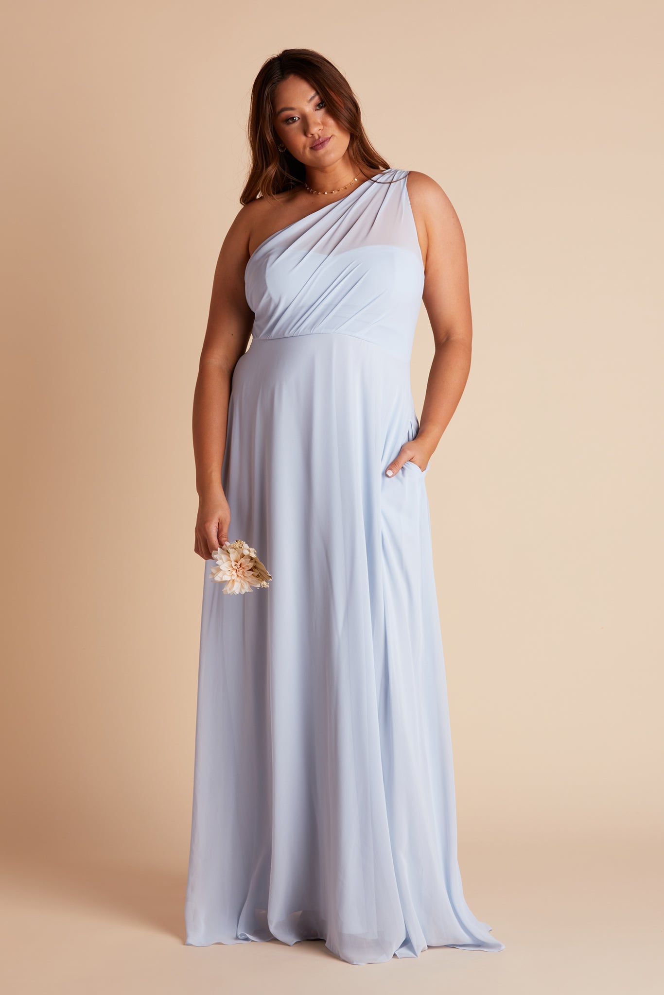 Kira plus size bridesmaids dress in ice blue chiffon by Birdy Grey, front view with hand in pocket