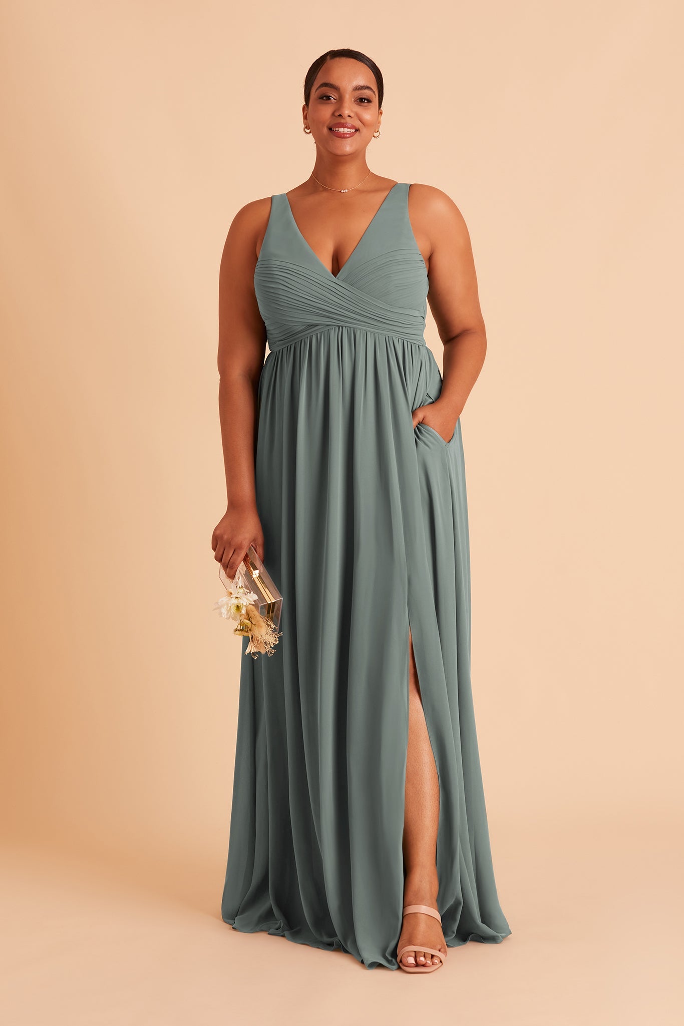 Laurie Empire plus size maternity bridesmaid dress with slit in sea glass chiffon by Birdy Grey, hand in pocket, front view