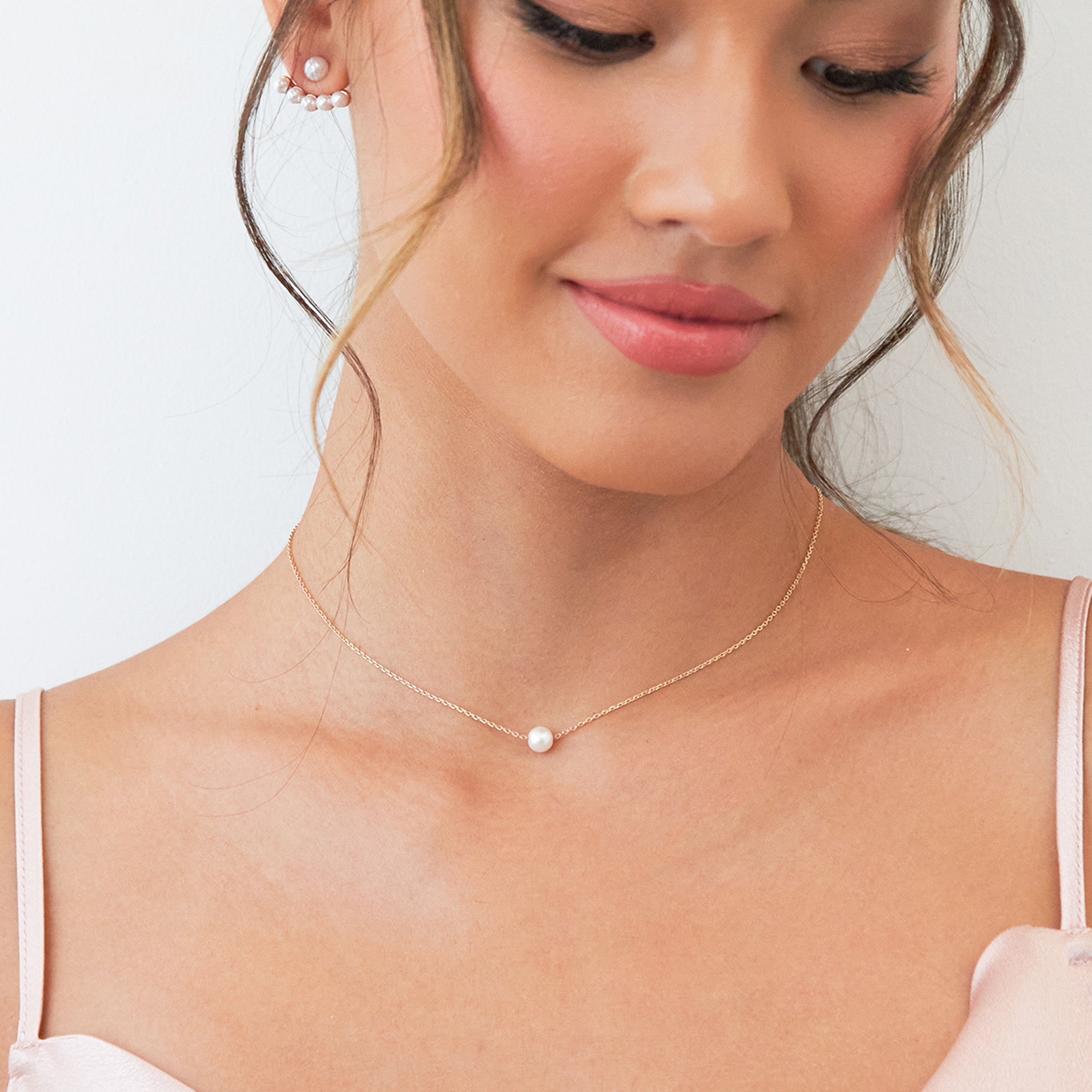 Front view of a model wearing the adjustable Santa Barbara Single Pearl Necklace.