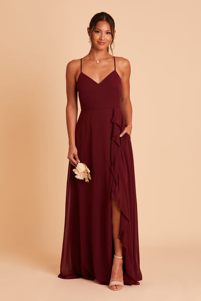 Theresa bridesmaid dress with slit in cabernet burgundy chiffon by Birdy Grey, hand in pocket, front view