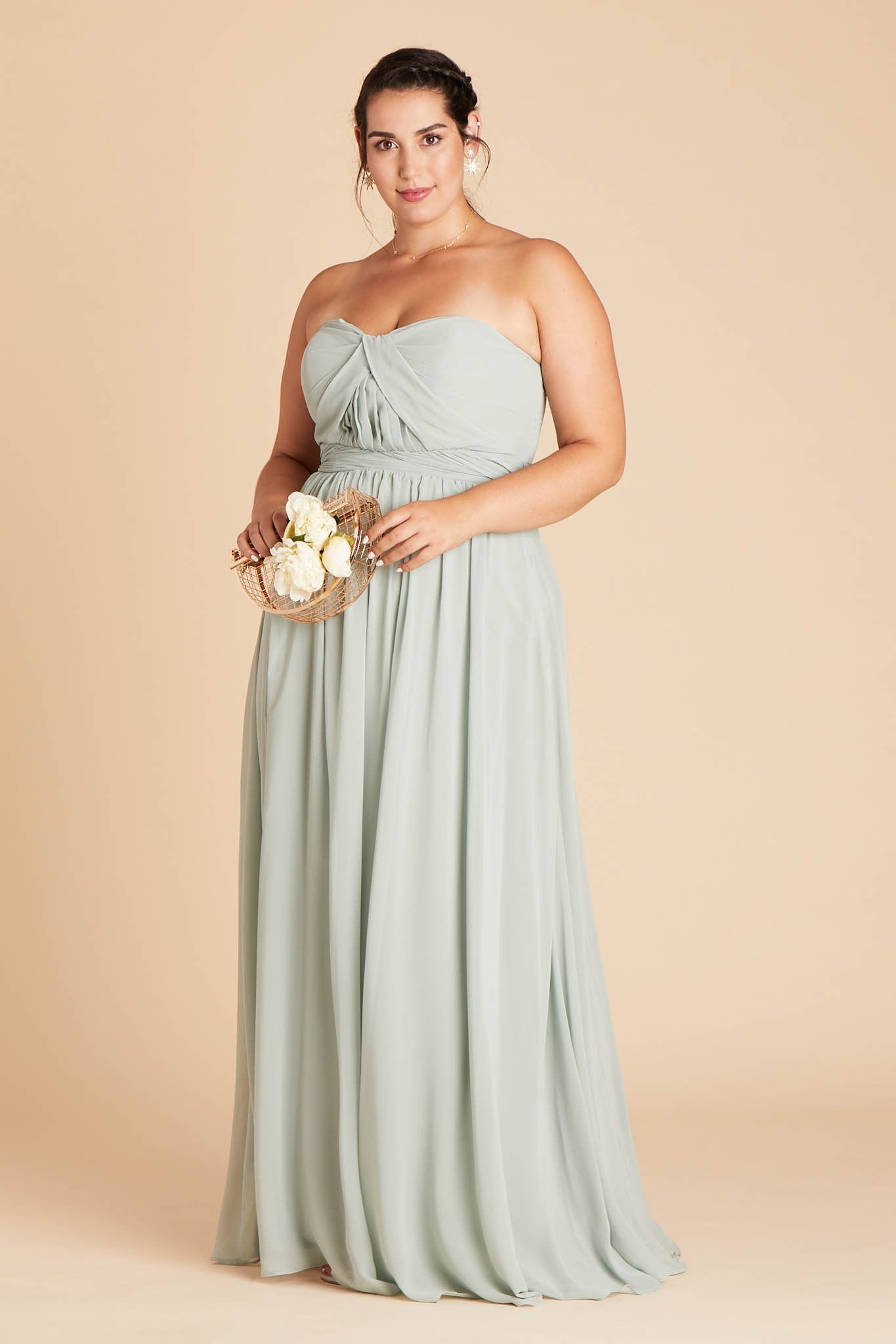 Front view of the Grace Convertible Dress Curve in sage chiffon worn by a full-figured model with a light skin tone. 